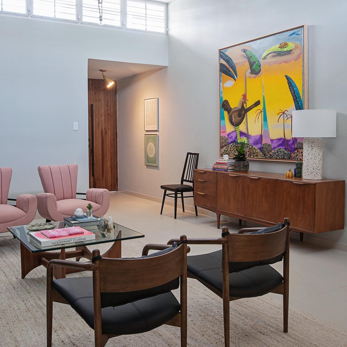 Our clients had an amazing contemporary art and mid century furniture collection they were unsure of where to hang and place properly. We came in and helped them create a cohesive arrangement, adding some new pieces of furniture, rugs, textures and l