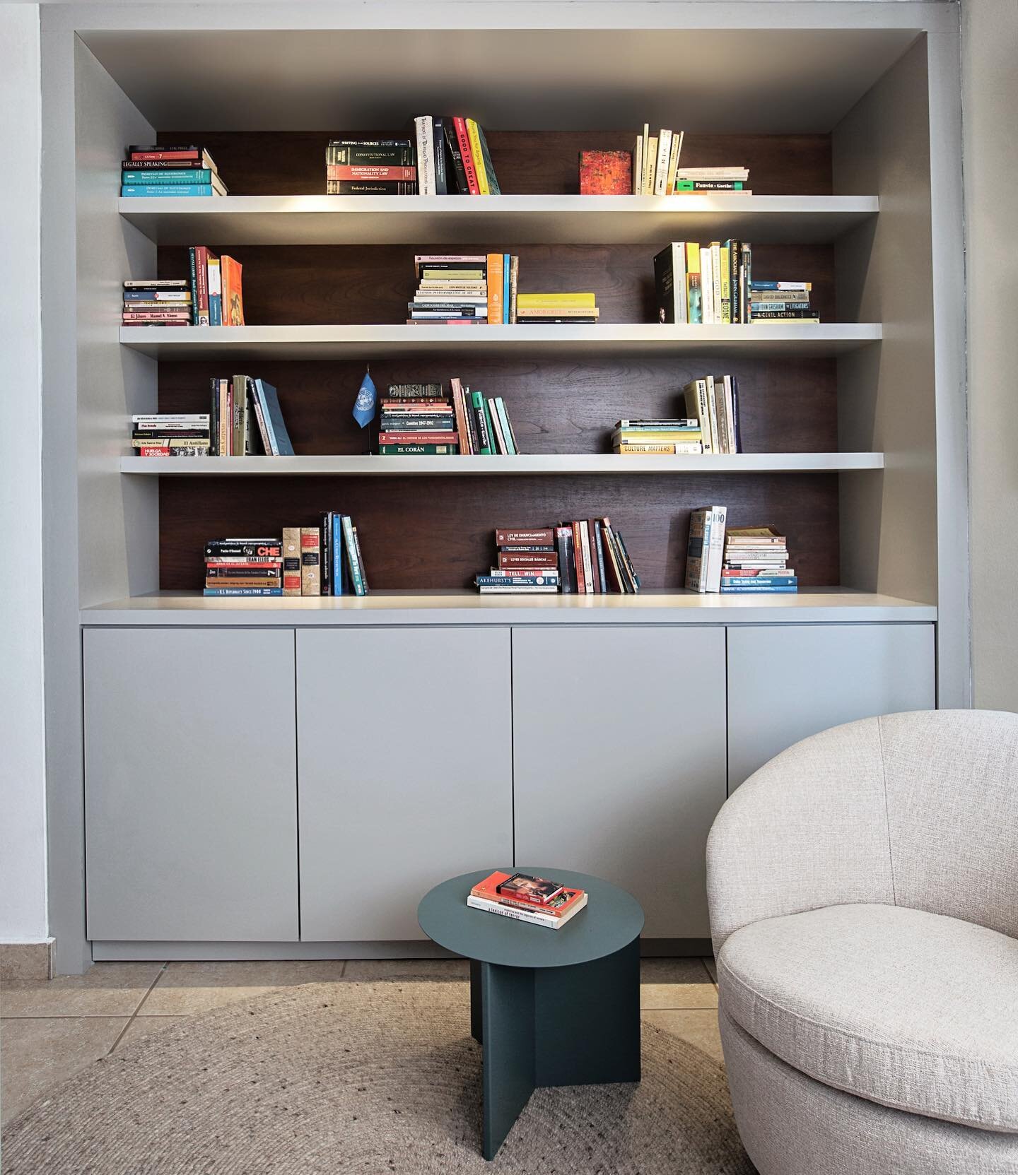 Home offices have become essential during covid era. In this project we turned an under utilized small bedroom into a loungey home office for a young lawyer couple. The closet became this built in bookcase with deep storage on the bottom for larger i