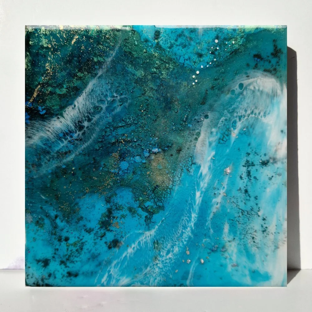 Blue resin abstract art with shades of blue, white, and black, ocean resin art, ocean epoxy art, ocean art, coastal decor, coastal art. Original bespoke abstract artwork created by artist Katie Alize, based in UK, Essex, London.