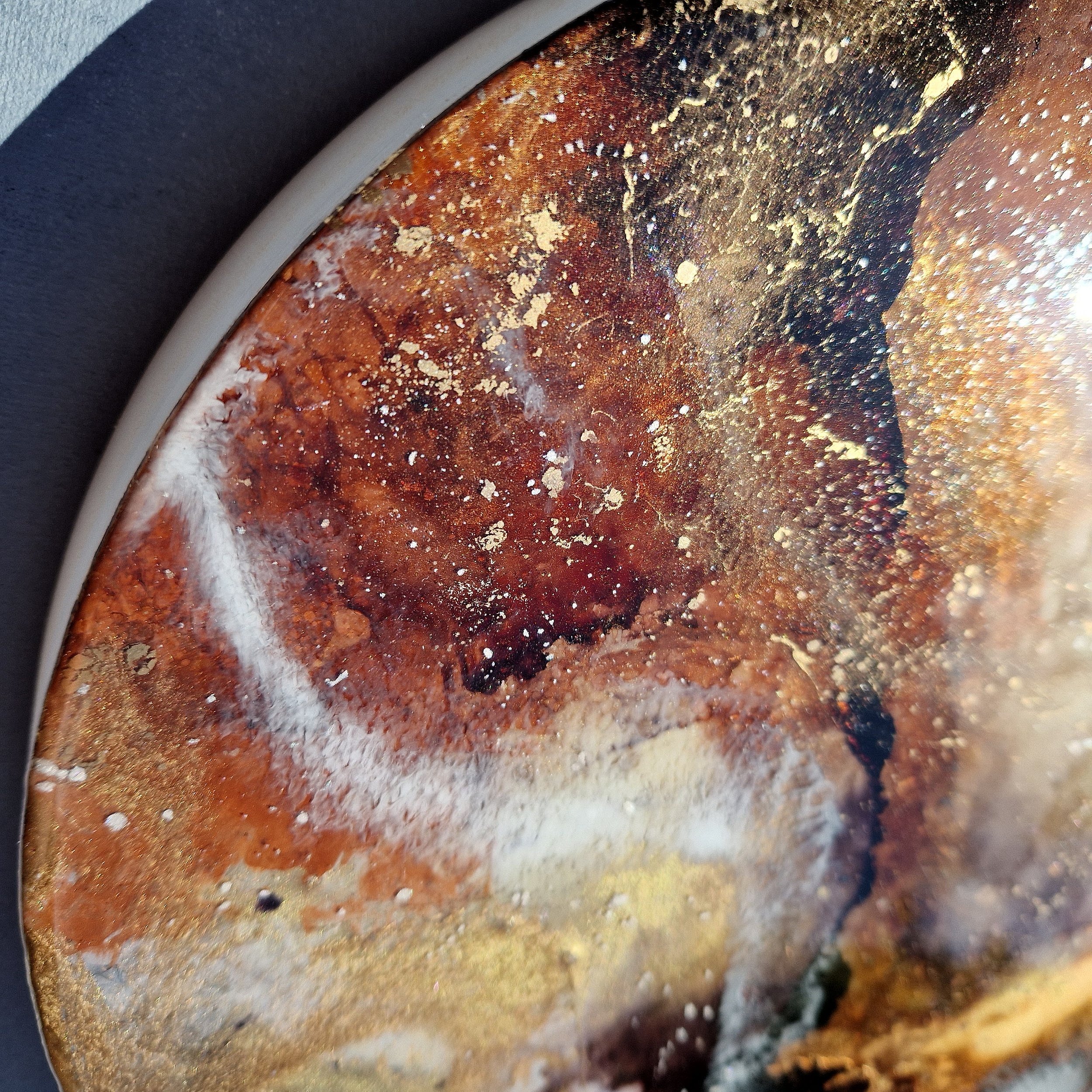Coffee inspired round wall art inspired by the rich, warm hues of coffee. The piece is made from resin and mixed media materials. Perfect for adding a touch of organic art to any coffee lovers room.