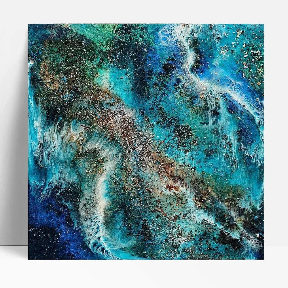Circular blue resin abstract art with shades of blue, white, and black, ocean resin art, ocean epoxy art, ocean art, coastal decor, coastal art. Original bespoke abstract artwork created by artist Katie Alize, based in UK, Essex, London.