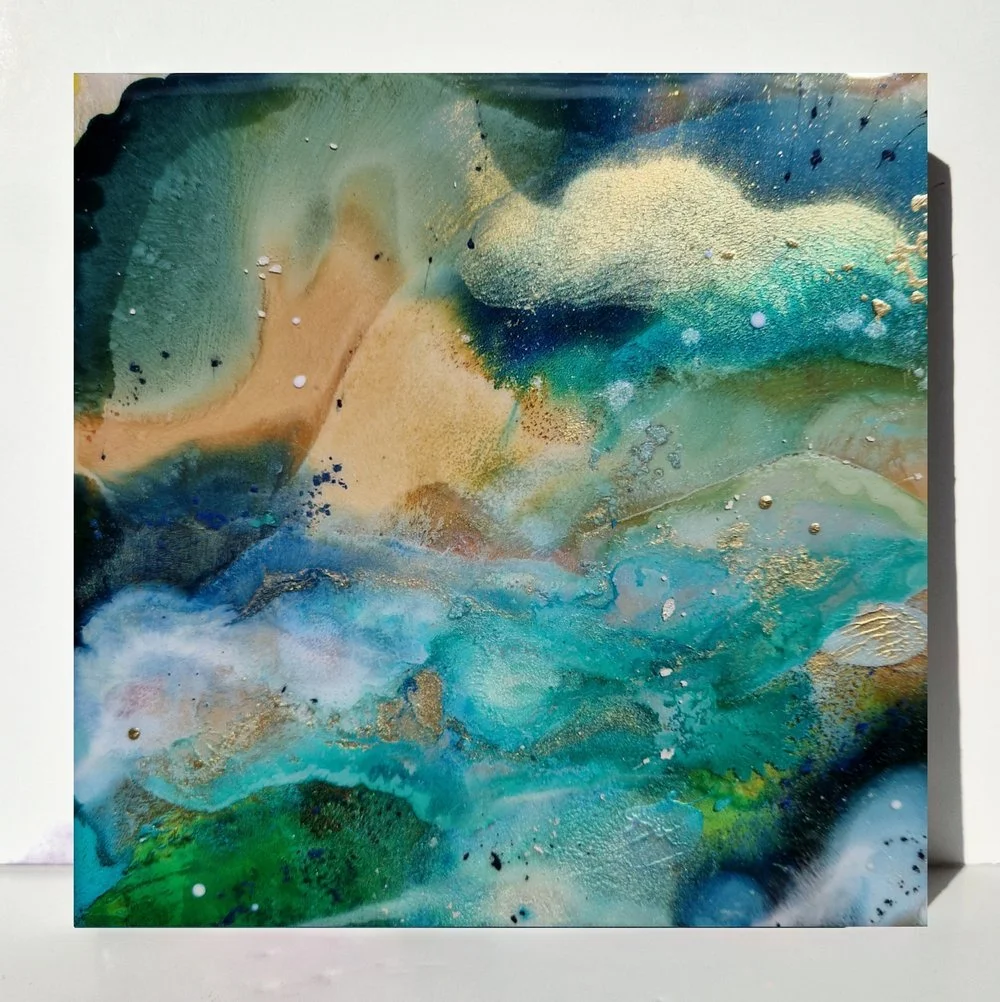 Circular blue resin abstract art with shades of blue, white, and black, ocean resin art, ocean epoxy art, ocean art, coastal decor, coastal art. Original bespoke abstract artwork created by artist Katie Alize, based in UK, Essex, London.