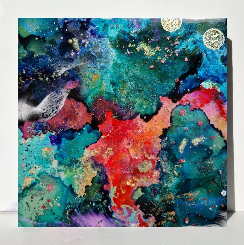 Circular blue resin abstract art with shades of blue, white, and black, ocean resin art, ocean epoxy art, ocean art, coastal decor, coastal art. Original bespoke abstract artwork created by artist Katie Alize, based in UK, Essex, London. Resin galaxy