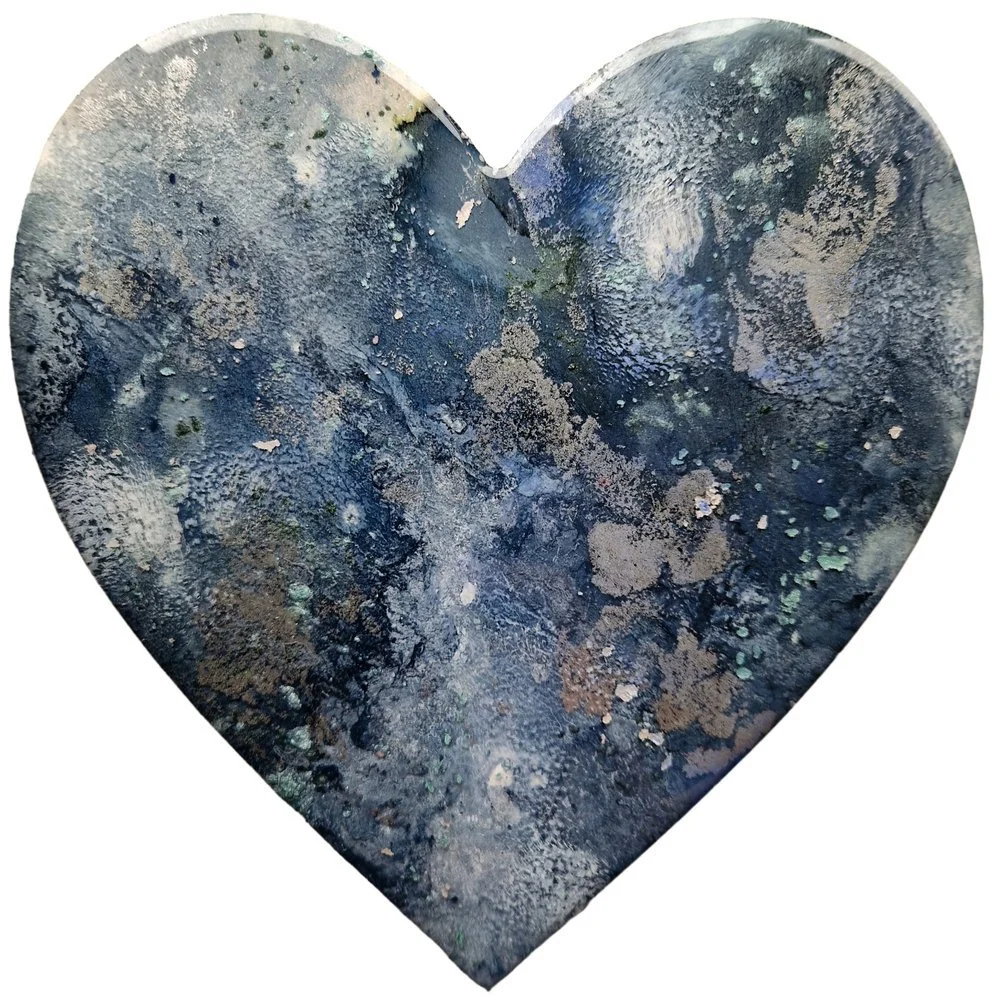 A heart-shaped art with a textured, abstract pattern in shades of dark blue, black, and gray. Abstract resin heart painting with pink, purple, black, and gold. Original bespoke abstract resin ink and mixed media artwork created by artist Katie Alize