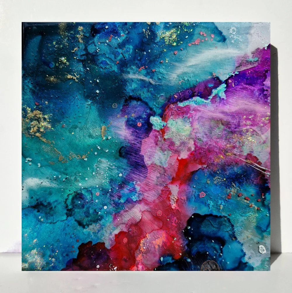 Circular blue resin abstract art with shades of blue, white, and black, ocean resin art, ocean epoxy art, ocean art, coastal decor, coastal art. Original bespoke abstract artwork created by artist Katie Alize, based in UK, Essex, London.