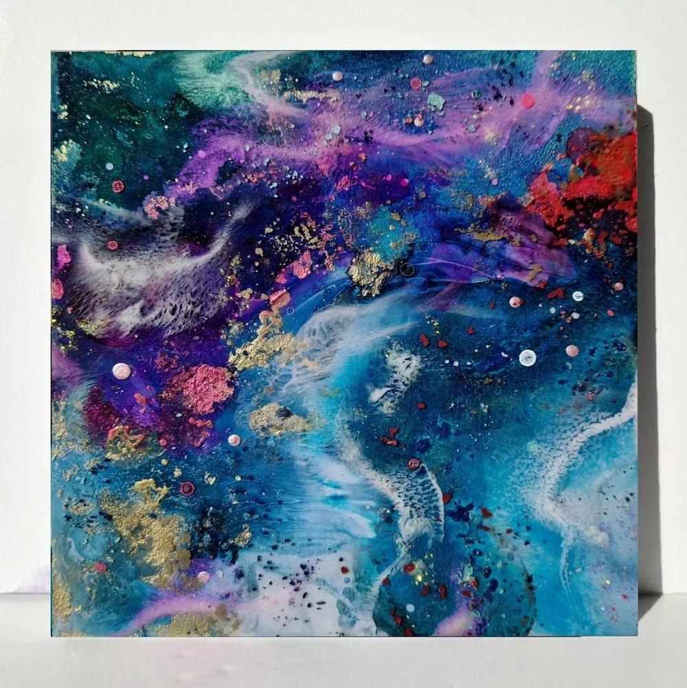 Circular blue resin abstract art with shades of blue, white, and black, ocean resin art, ocean epoxy art, ocean art, coastal decor, coastal art. Original bespoke abstract artwork created by artist Katie Alize, based in UK, Essex, London.