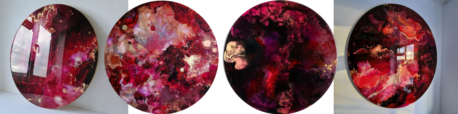 Four circular custom bespoke abstract art Katie Alize resin art paintings with red, pink, black, and gold hanging on a white wall.