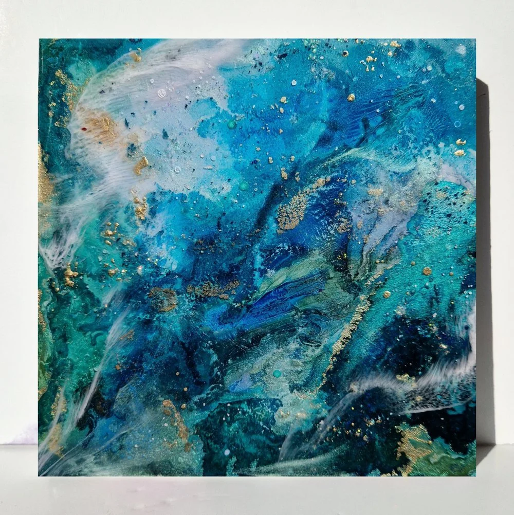 Blue resin abstract art with shades of blue, white, and black, ocean resin art, ocean epoxy art, ocean art, coastal decor, coastal art. Original bespoke abstract artwork created by artist Katie Alize, based in UK, Essex, London.