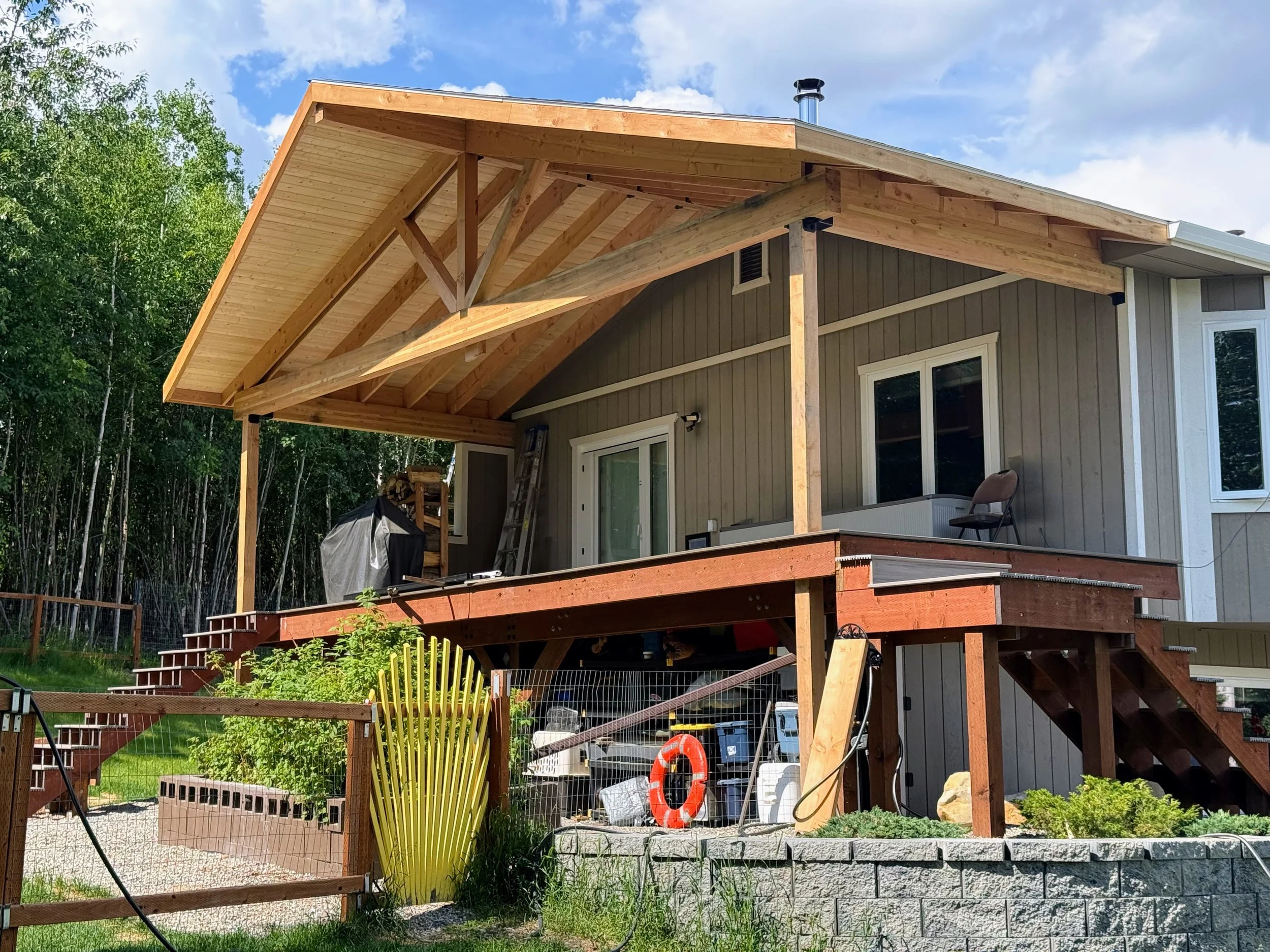 Large porch roof with tongue-and-groove and open timber framing