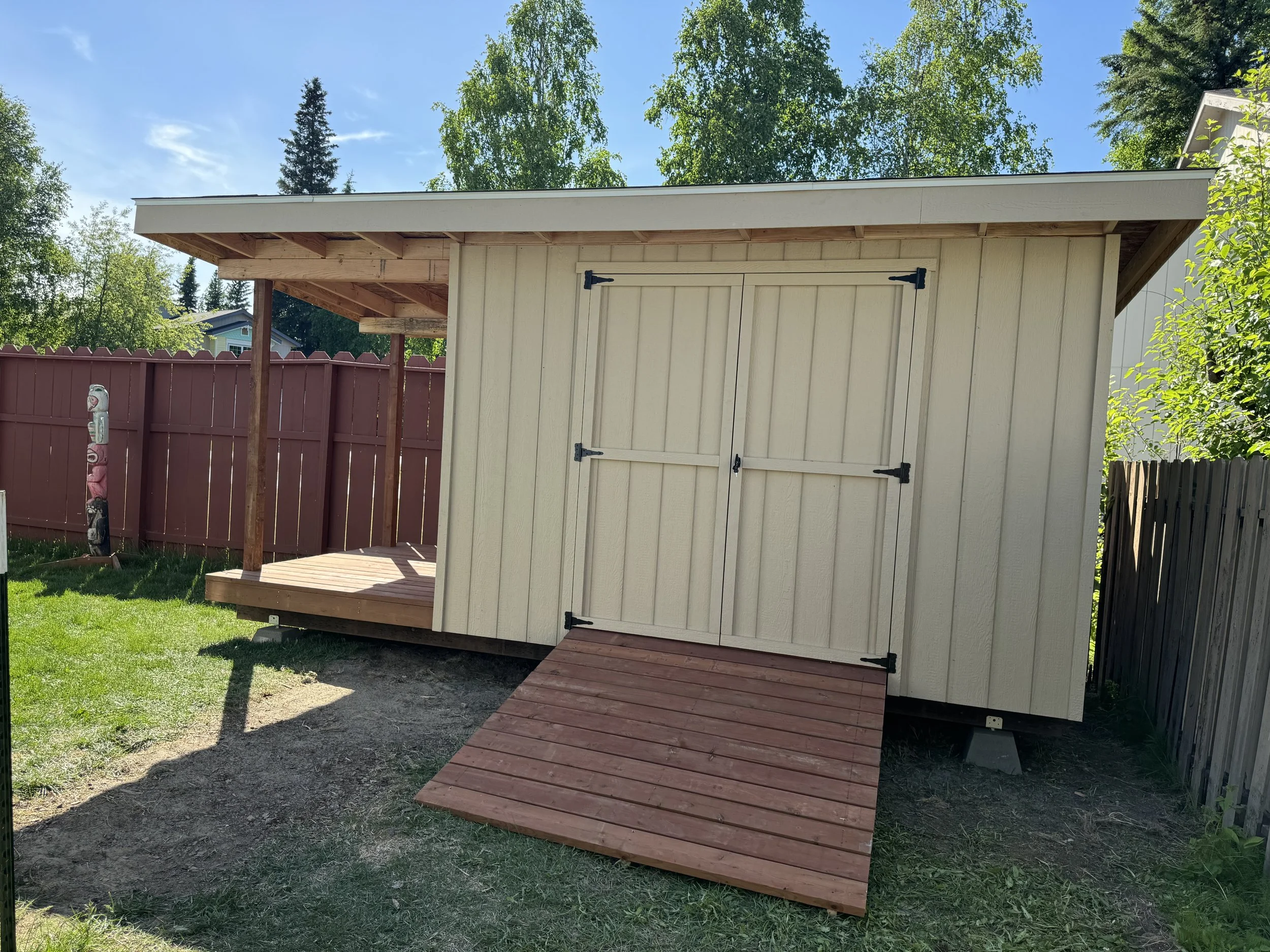 8x12 shed with a spot to stack wood on the side