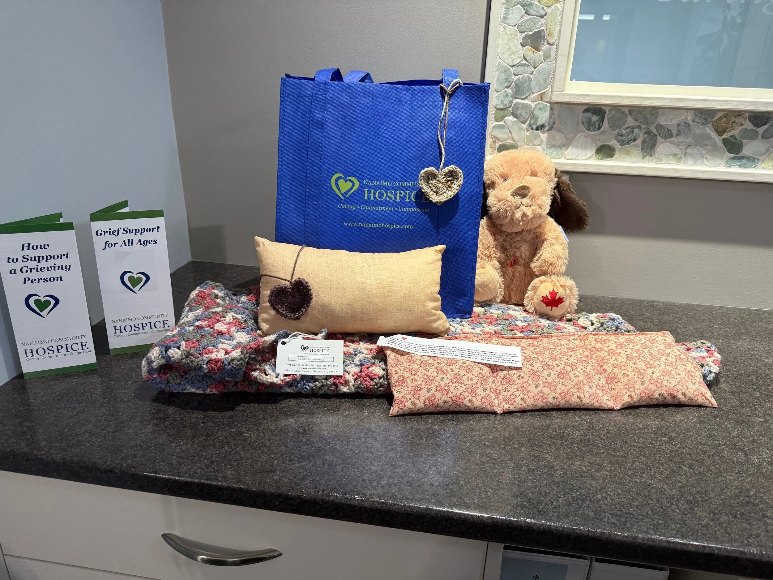 Nanaimo Community Hospice volunteers assembling Comfort Care Kits for individuals and families receiving hospice care at the Palliative Care Unit.