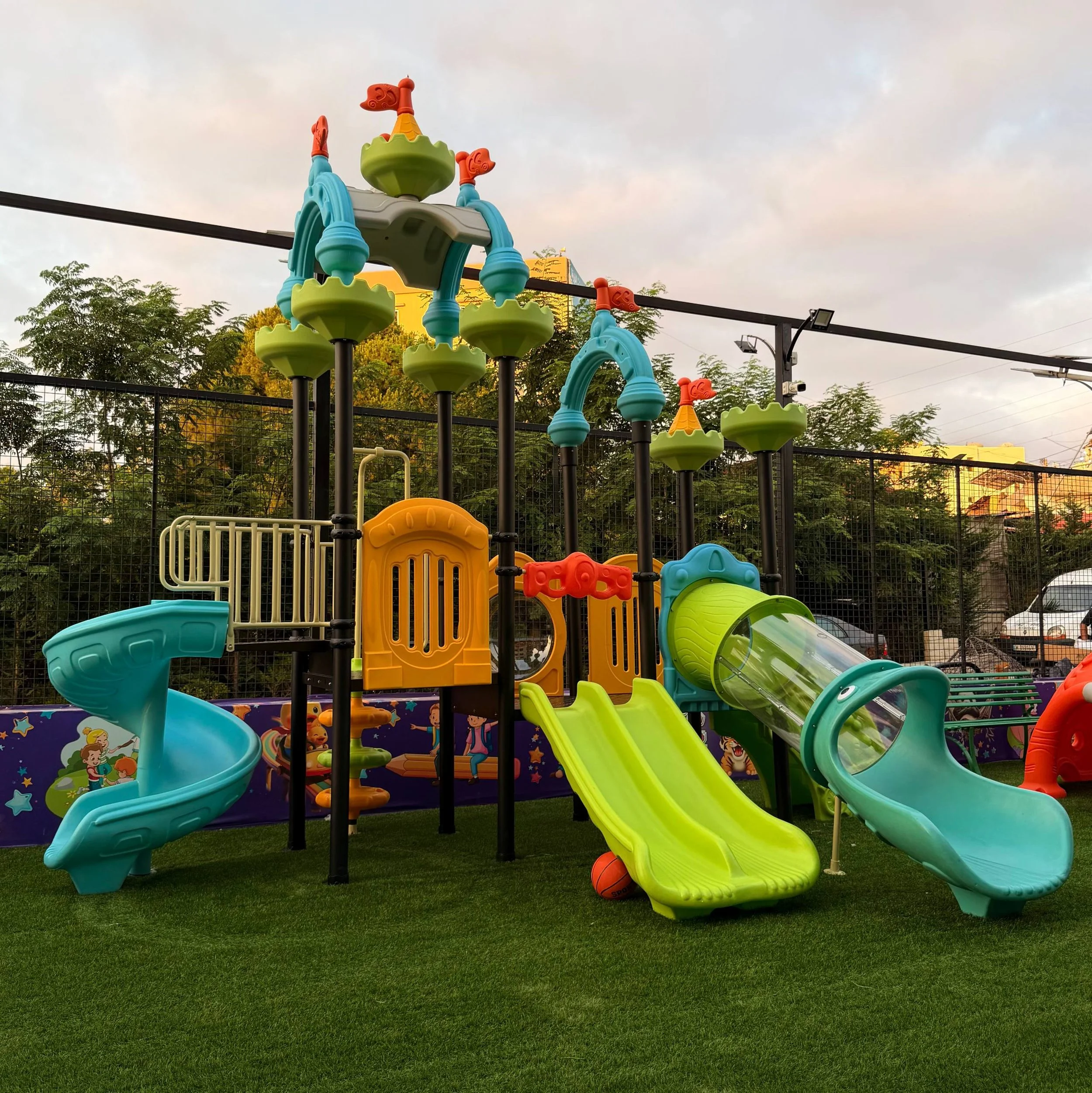 Castle-themed commercial playground with multiple slides, climbing activities, and play towers, designed for schools, parks, and outdoor recreational spaces.