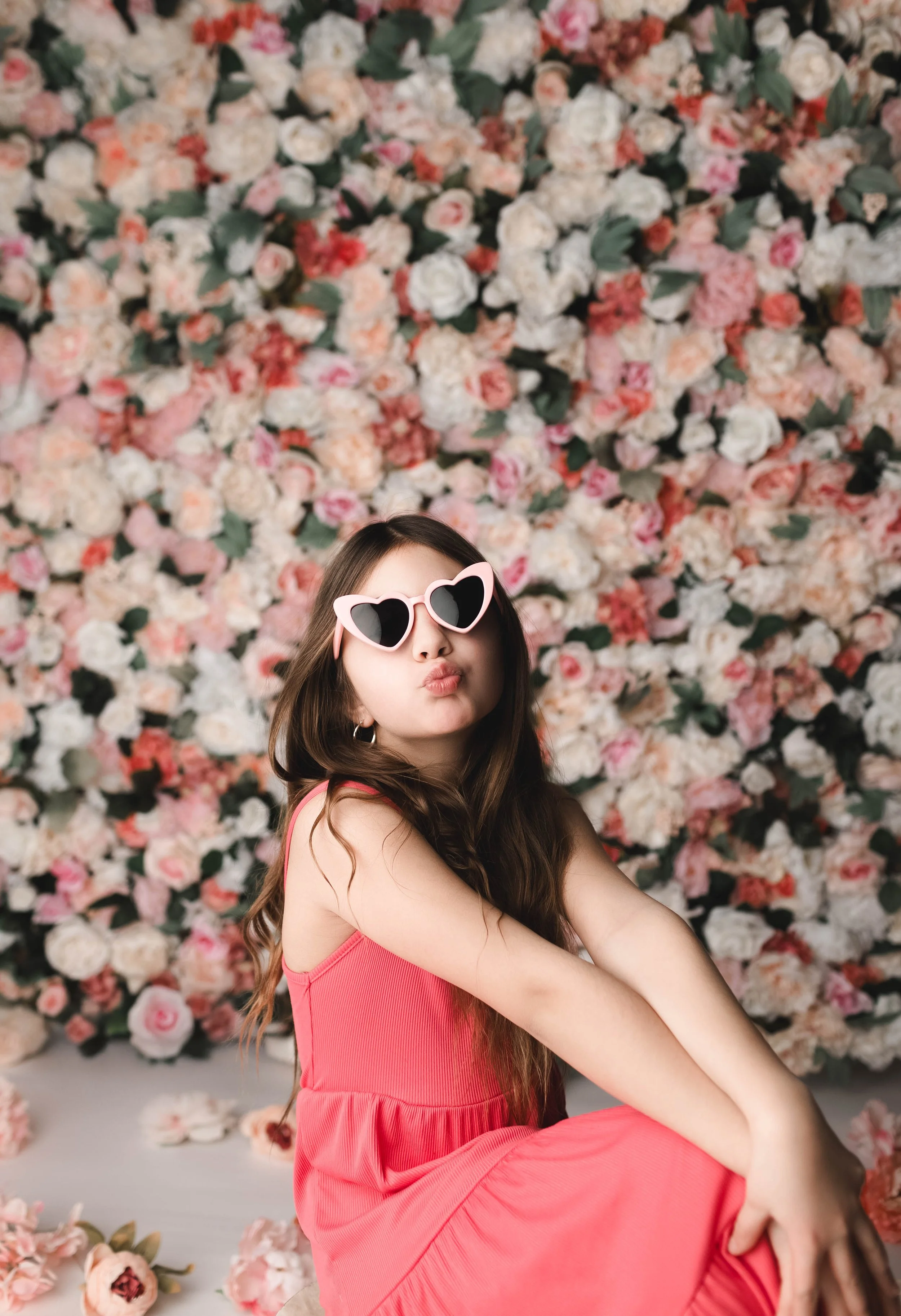 Posed session in front of flower wall