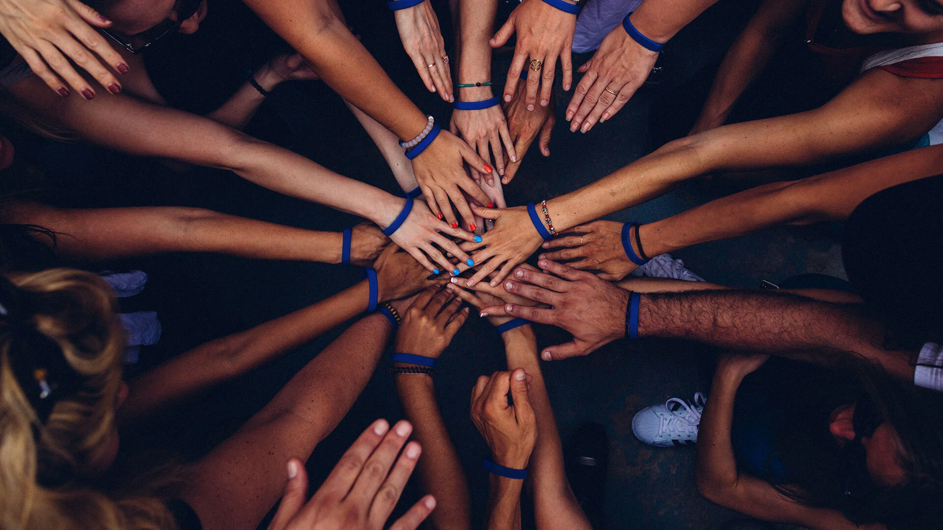 Hands together signaling teamwork