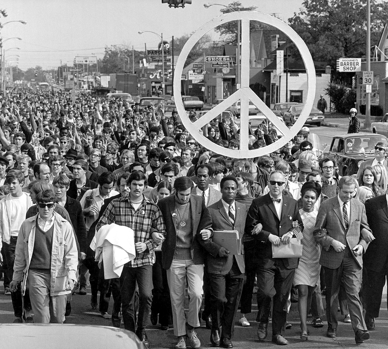 The October 15, 1969, Moratorium protest of over 5,000 students and faculty at Michigan State University in Lansing, MI, including the  MSU Acting President and several state representatives.  Photo by Bob Ivans, Michigan State News.