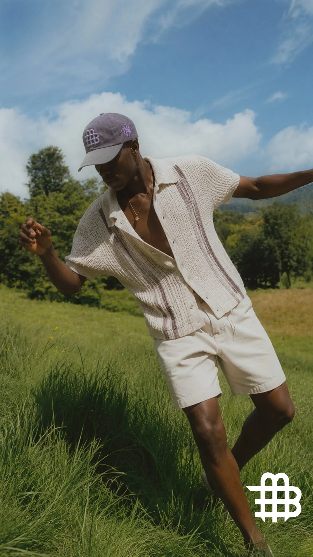 Black Male Wearing Hat In Park.jpg