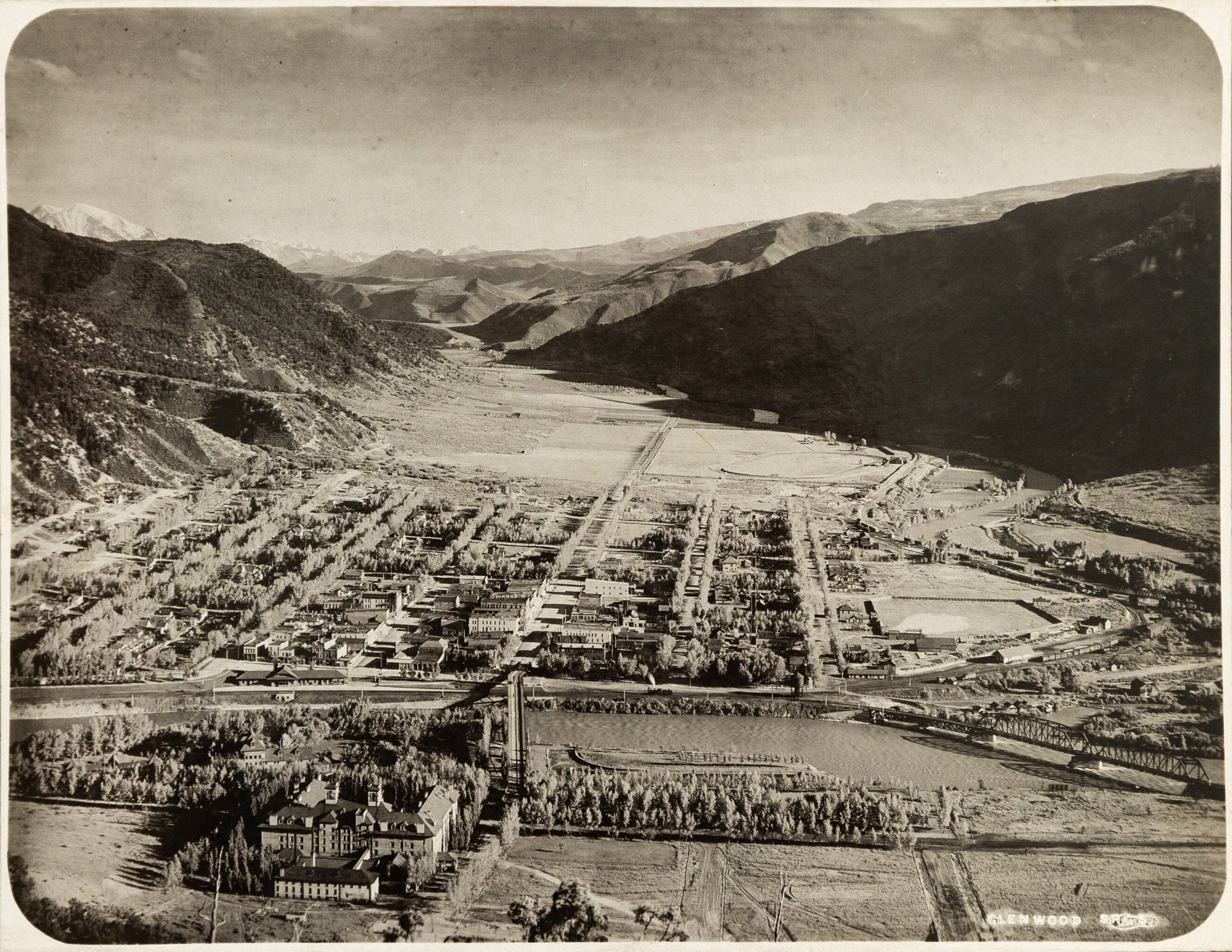 Ariel of Glenwood Springs, Glenwood Springs, Date Unknown. Molly Brown Archives. Historic view of the town along the Colorado River.
