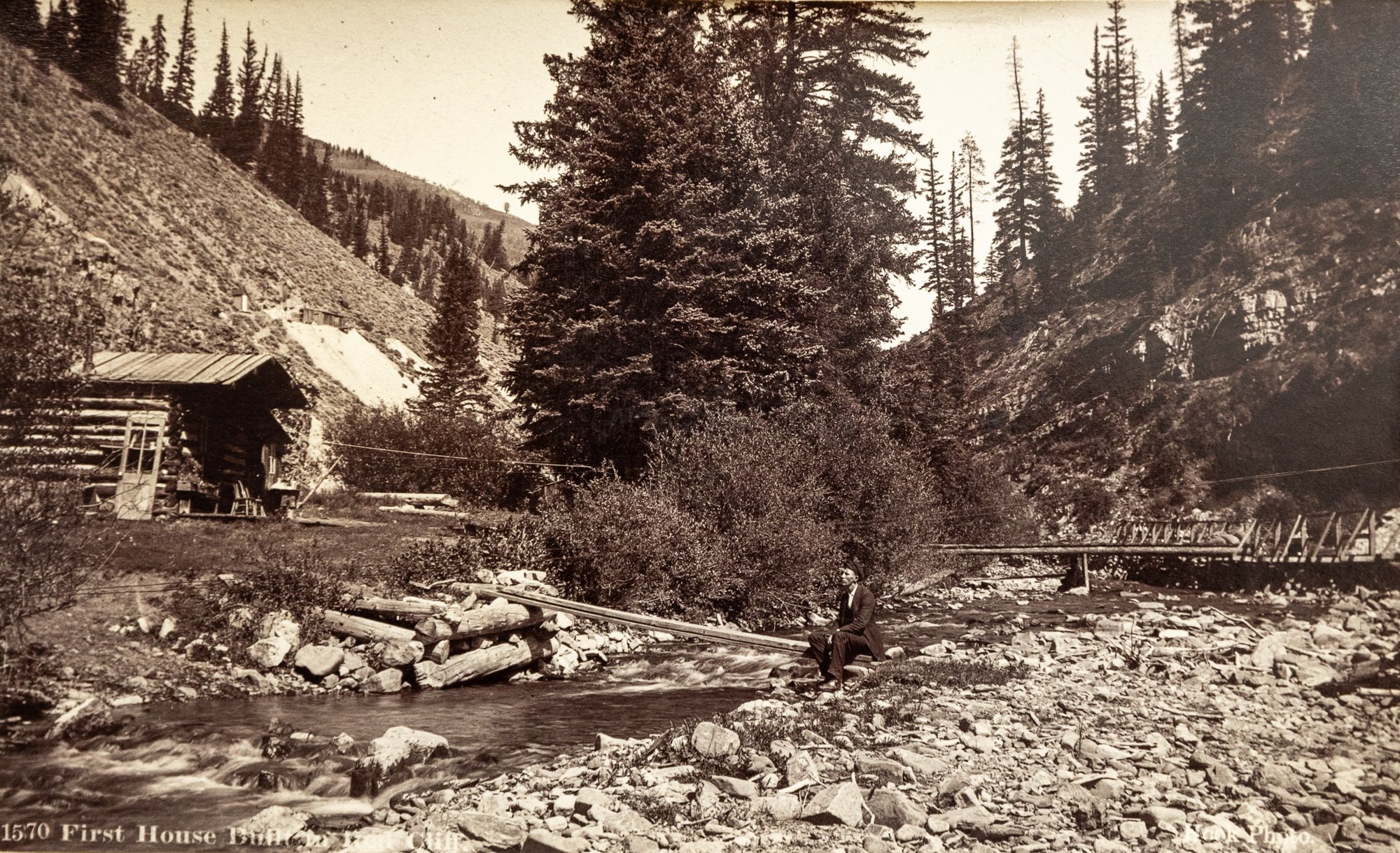 The First Home Built in Red Cliff, Red Cliff, Date Unknown. Photography by William Edward Hook. Molly Brown Archives. The mining boomtown of Red Cliff was the first permanent settlement on the Eagle River. Rail service here started in 1881. Passen