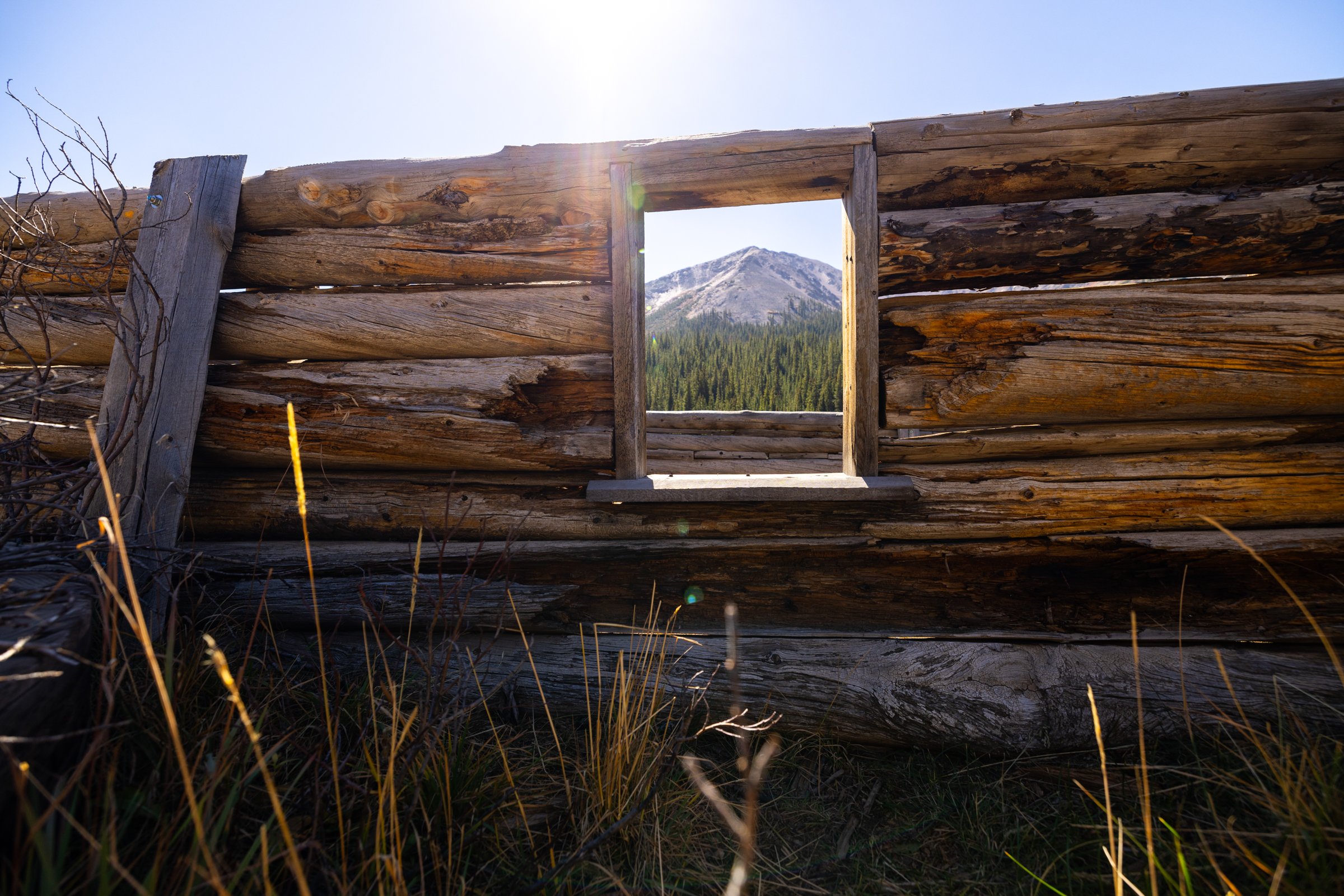 In 'n Out, Independence, 2024. A historic building with no roof stands at the foot of Independence Mountain in the Sawatch Range. Gold was struck here on July 4, 1879. The town grew as others got word of rich mineral deposits. At its height it housed