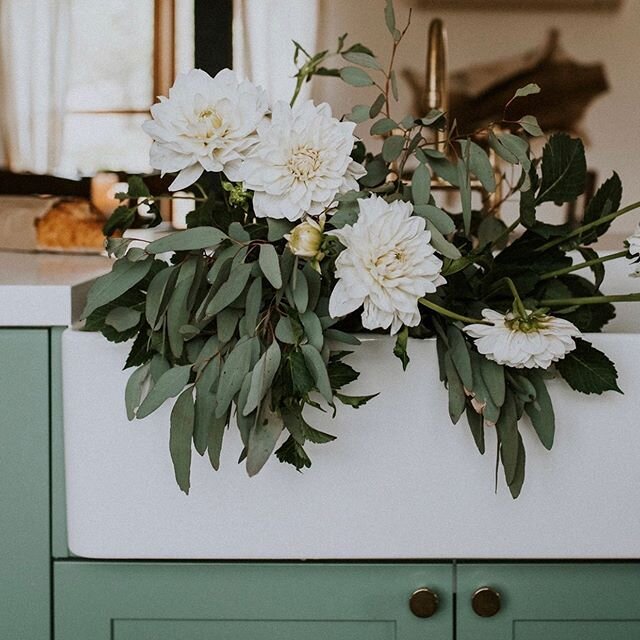 The double butler sink, the iconic farmhouse piece we could not go without when renovating The Ranch. When you stand here preparing your breakfast, washing the wine glasses from last night, you can see out the barn doors. You spot roos in the distanc