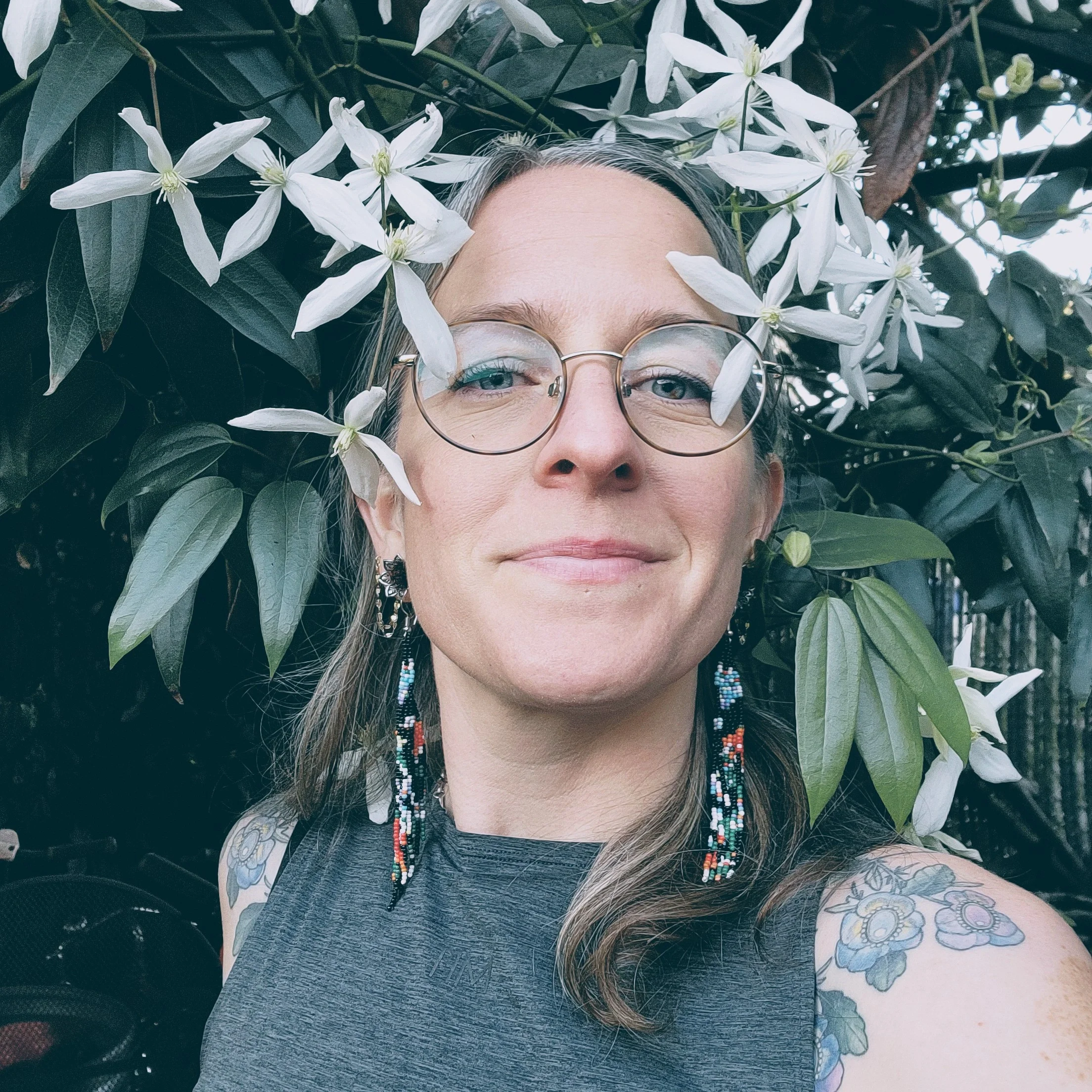 Kay with flowers 2026.webp