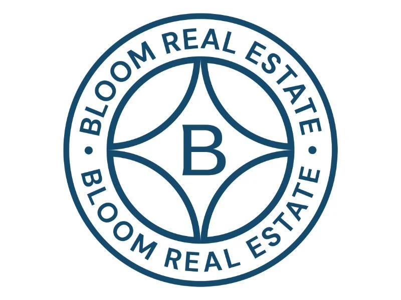 A logo for Bloom Real Estate with a circular design, the company name around the border, and a stylized 'B' in the center.