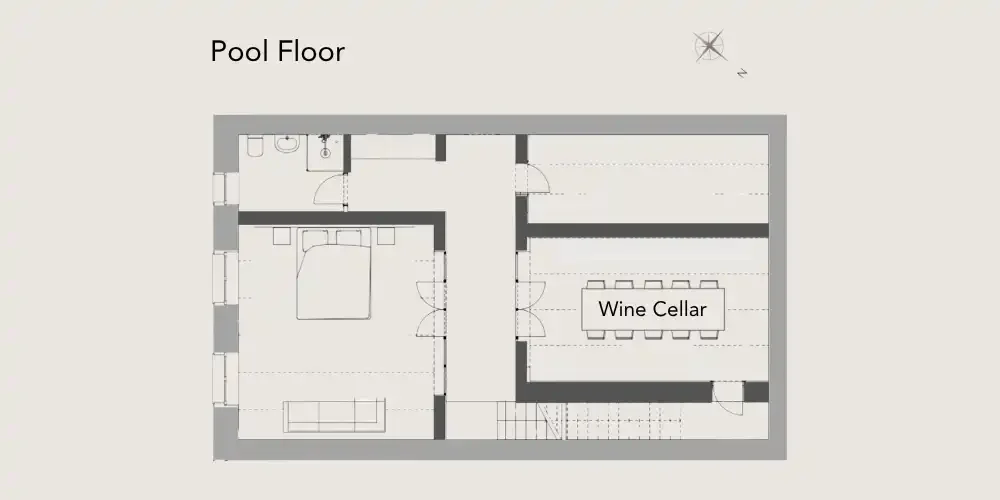 Floor plan showing a bedroom, bathroom, and a wine cellar with a dining table, stairs, and pool area