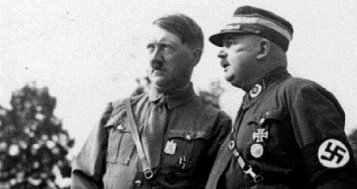 Hitler with his close friend Ernst Röhm (1887 – 1934), one of the members of the German Workers’ Party, and a co-founder of the Sturmabteilung (SA, “Storm Battalion”).