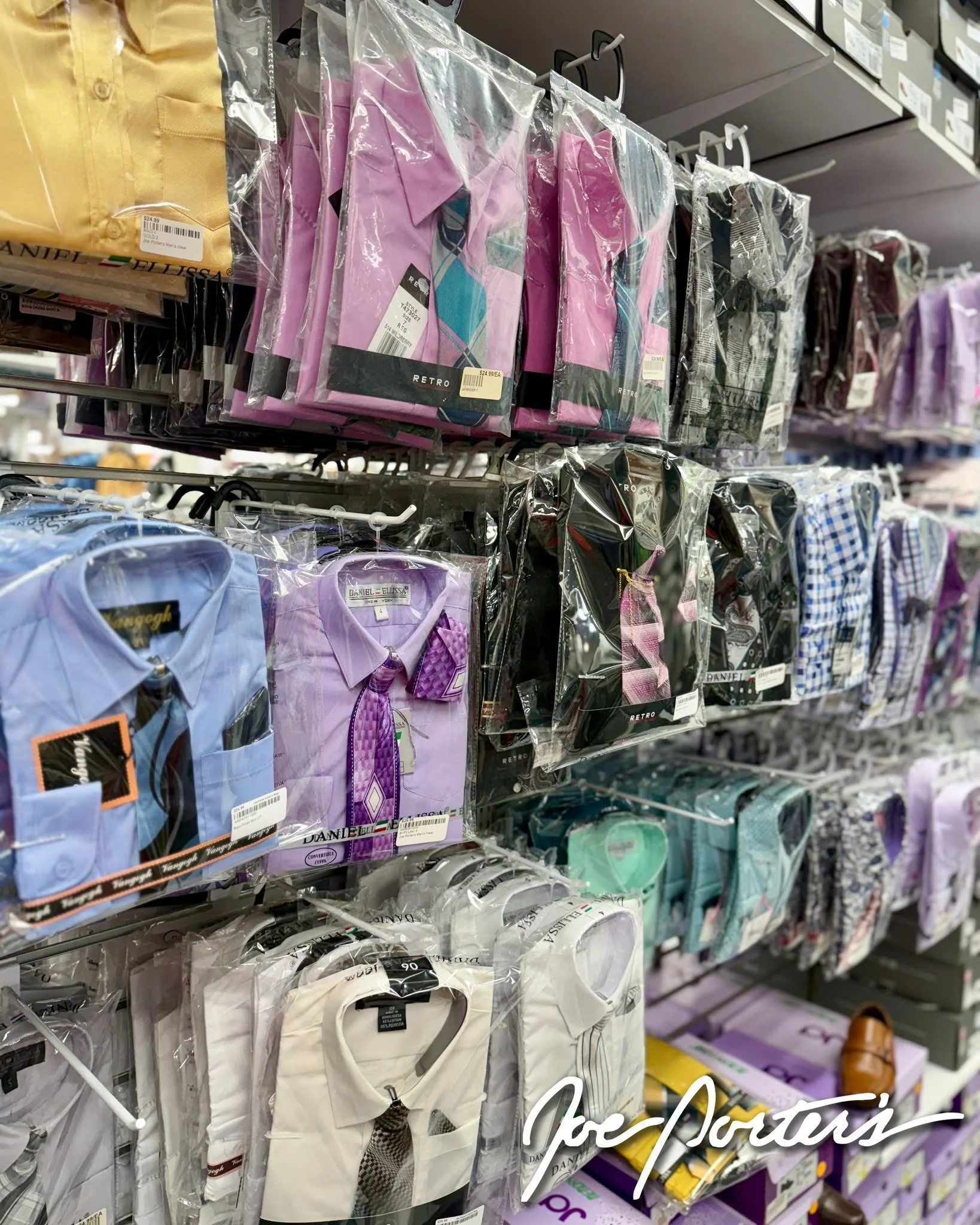 Retail store display of packaged men's dress shirts, ties, and colorful formalwear