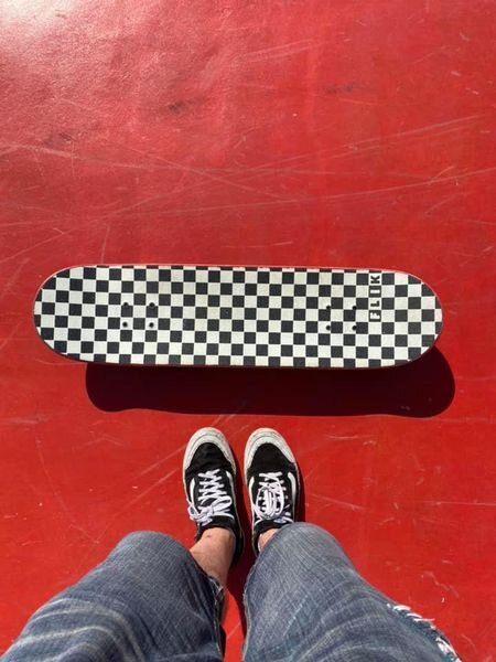 photo for website - skateboard on red.jpg