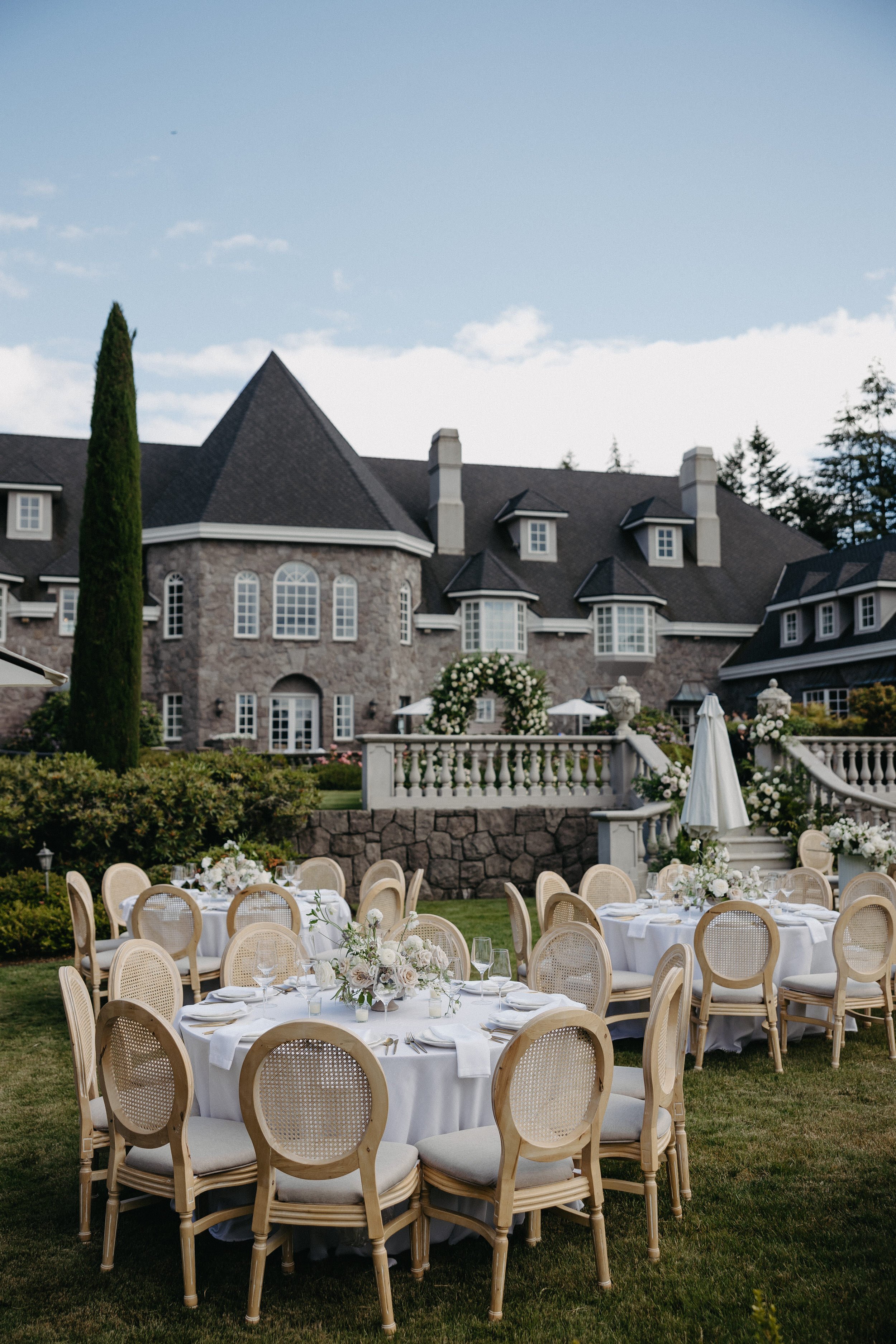chateau de michellia round tables rattan chairs