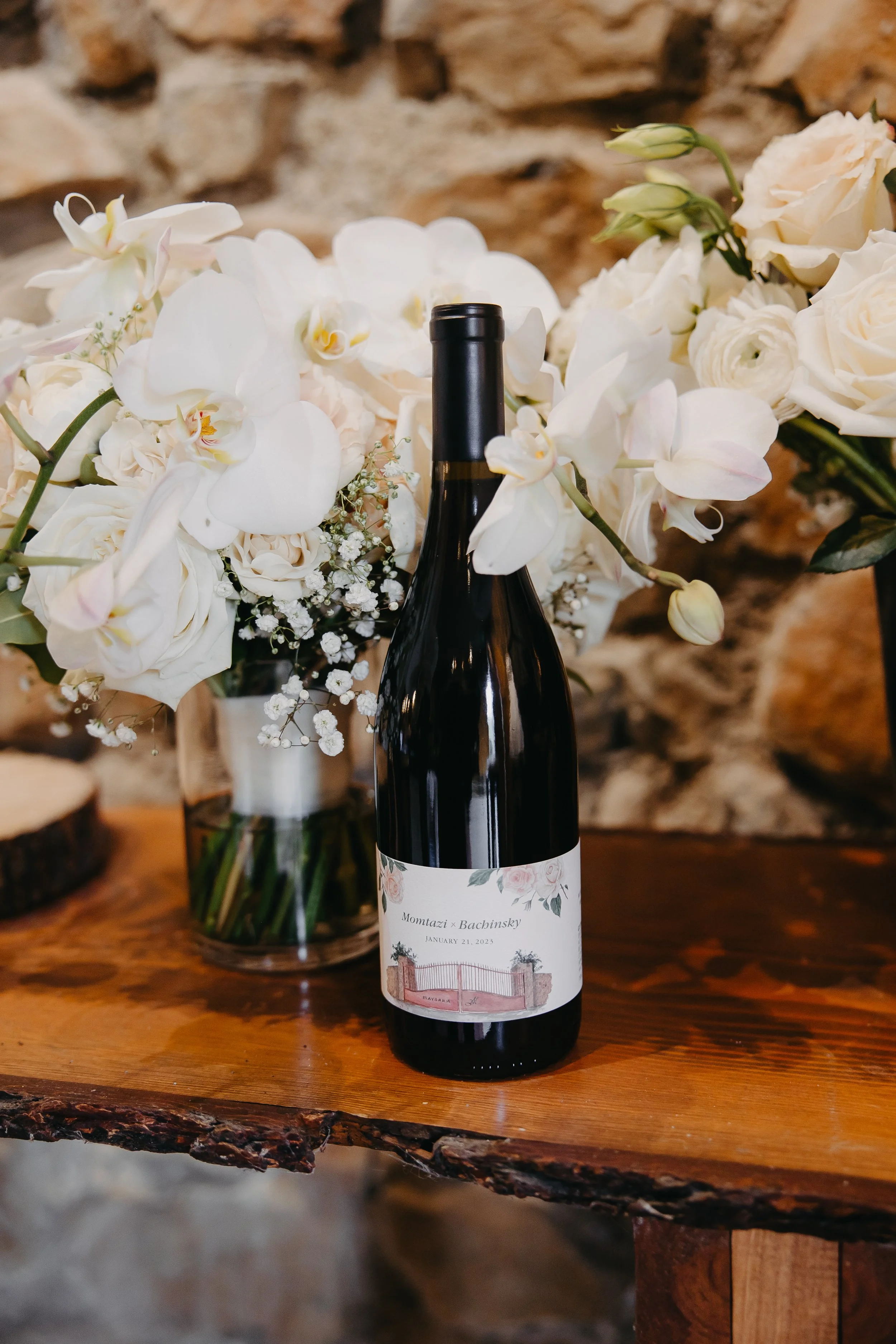 Image of wedding bouquet and custom wedding wine label on wine bottle at Maysara Winery
