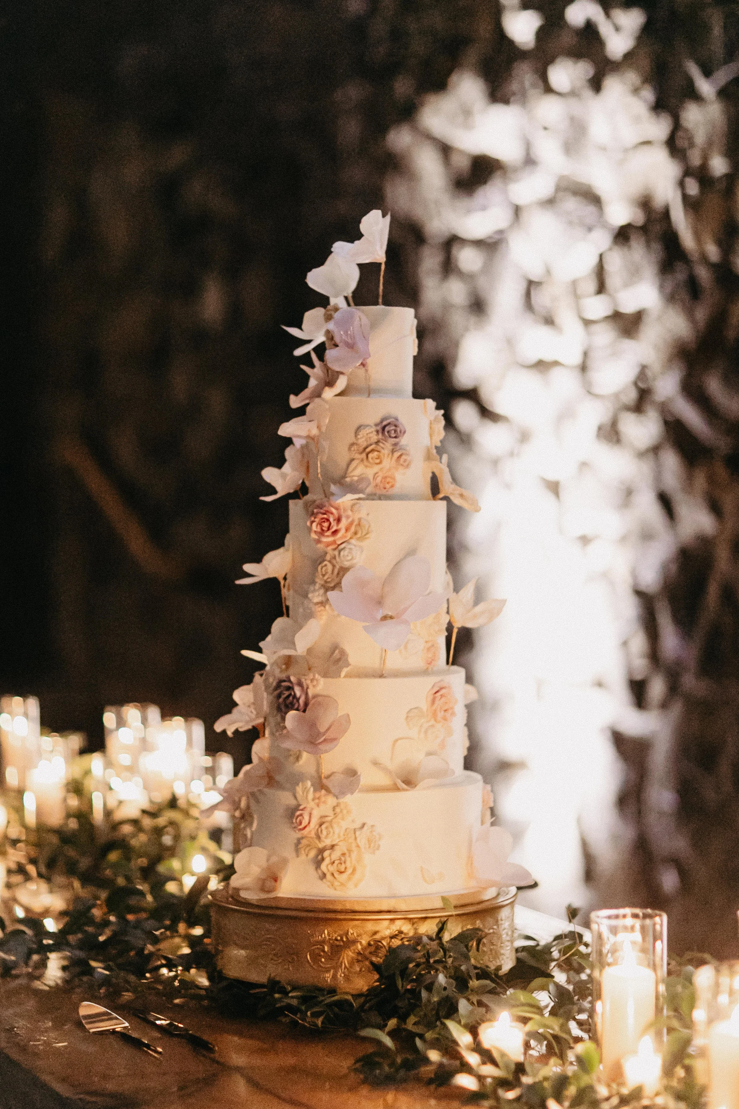5 tier white wedding cake with sugar flowers at winter wedding at Maysara winery