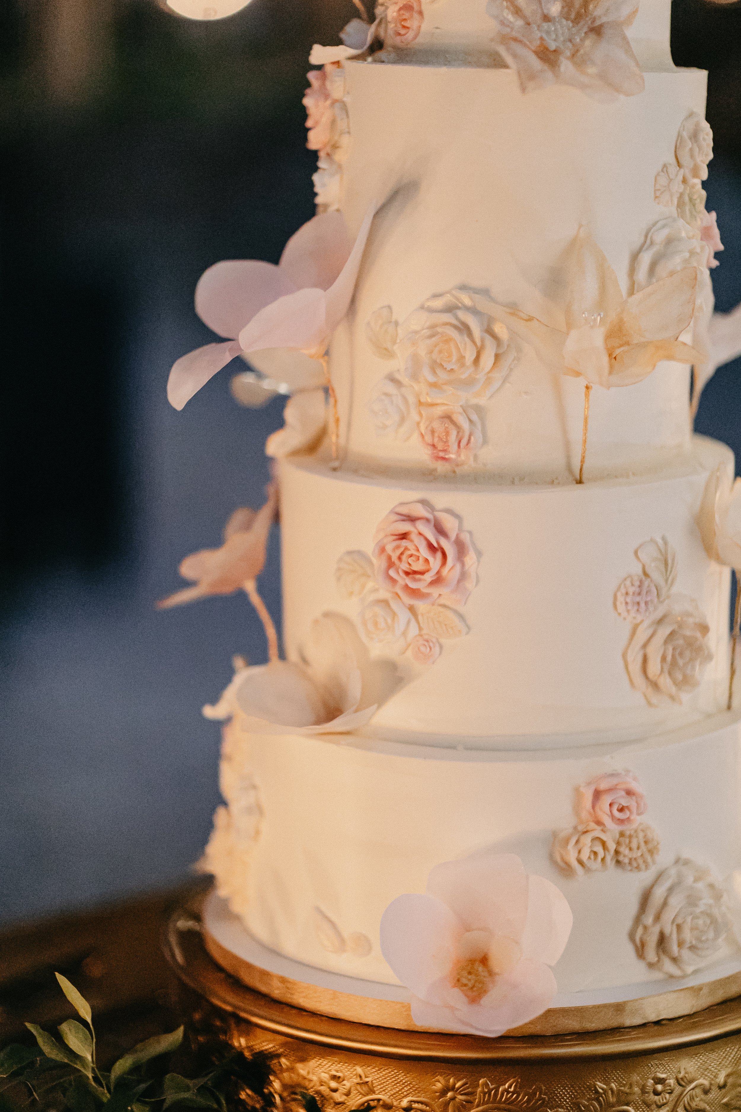 Close up of white wedding cake with sugar flowers at winter wedding at Maysara Winery