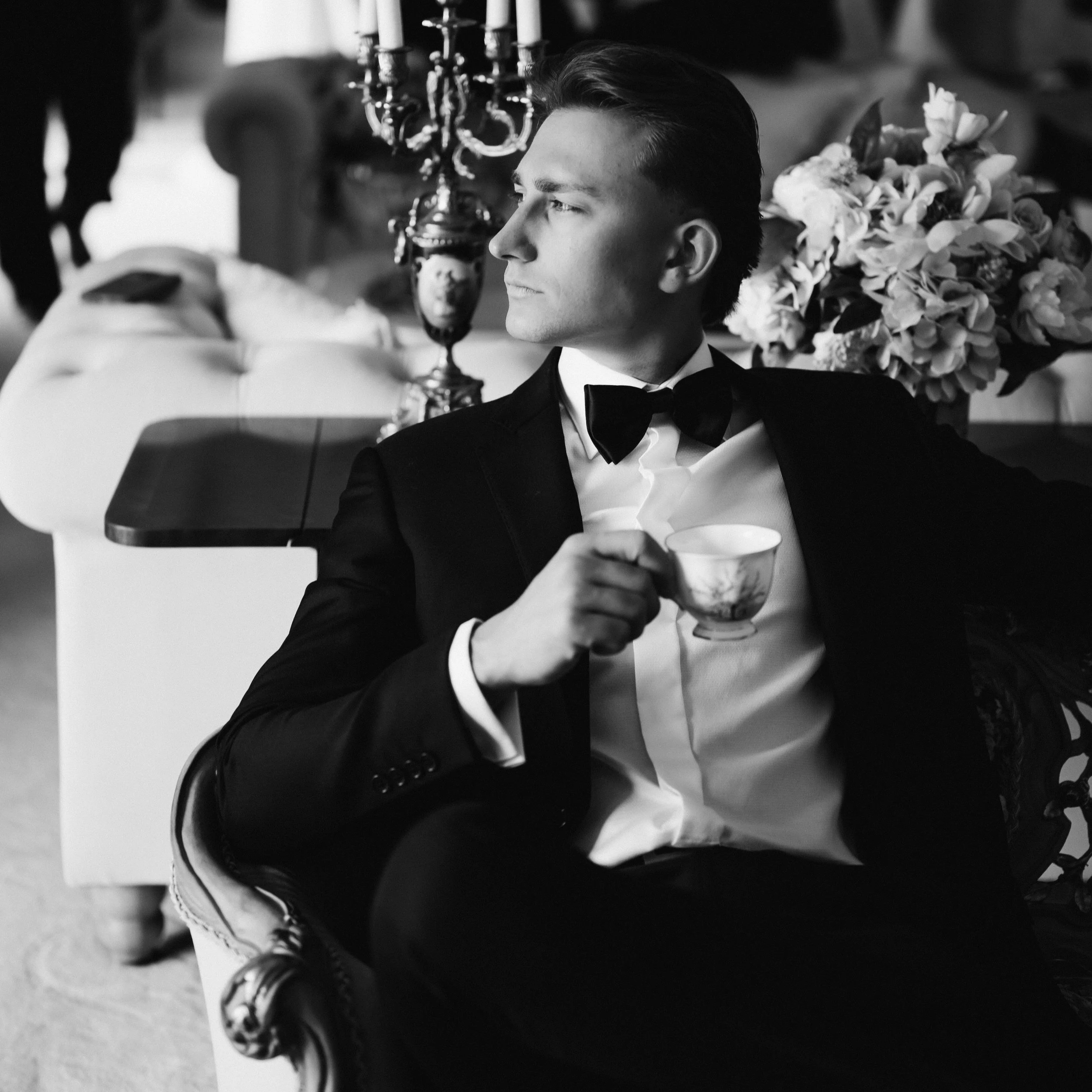black and white groom portrait drinking tea getting ready