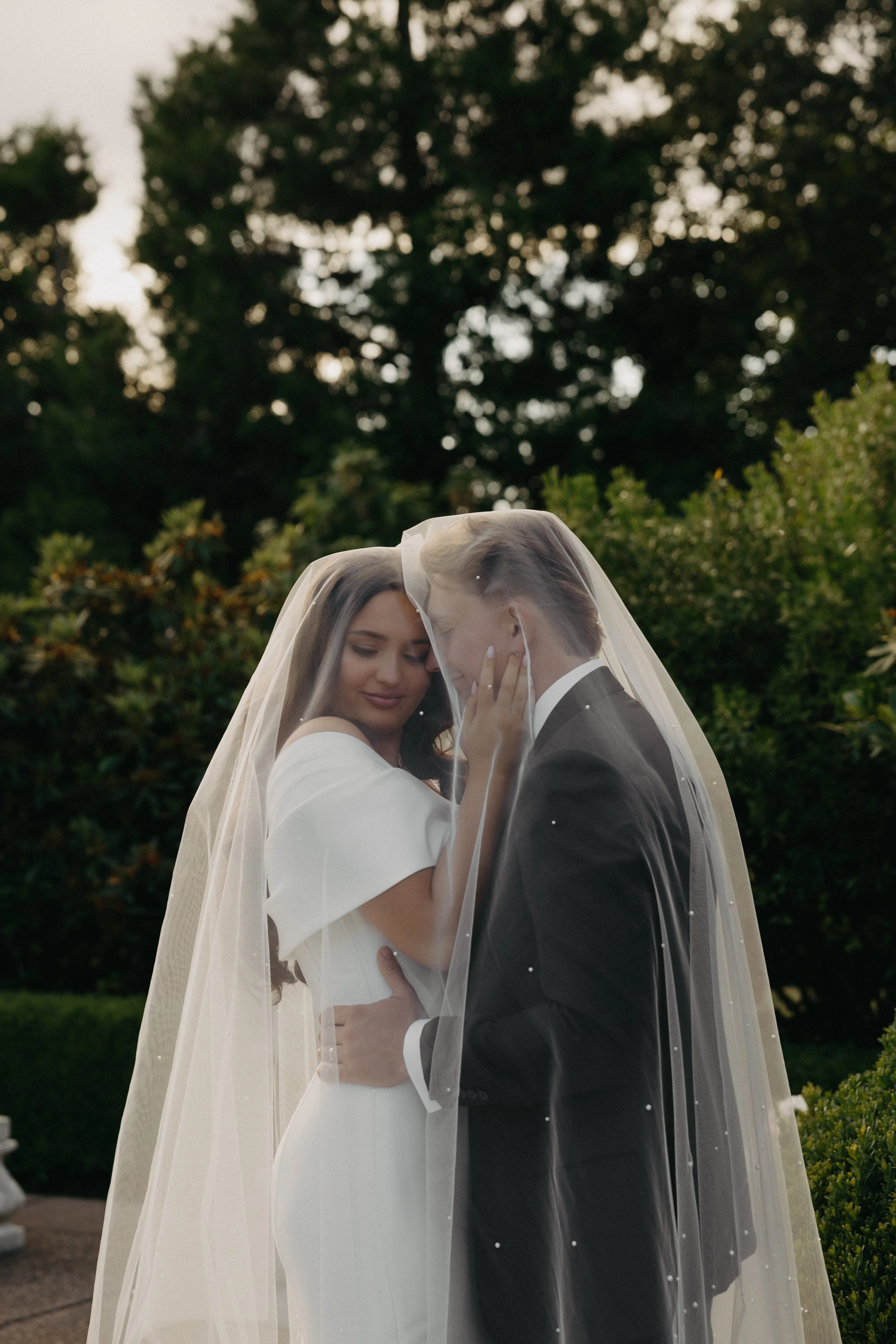 bride and groom sunset photos veil shot