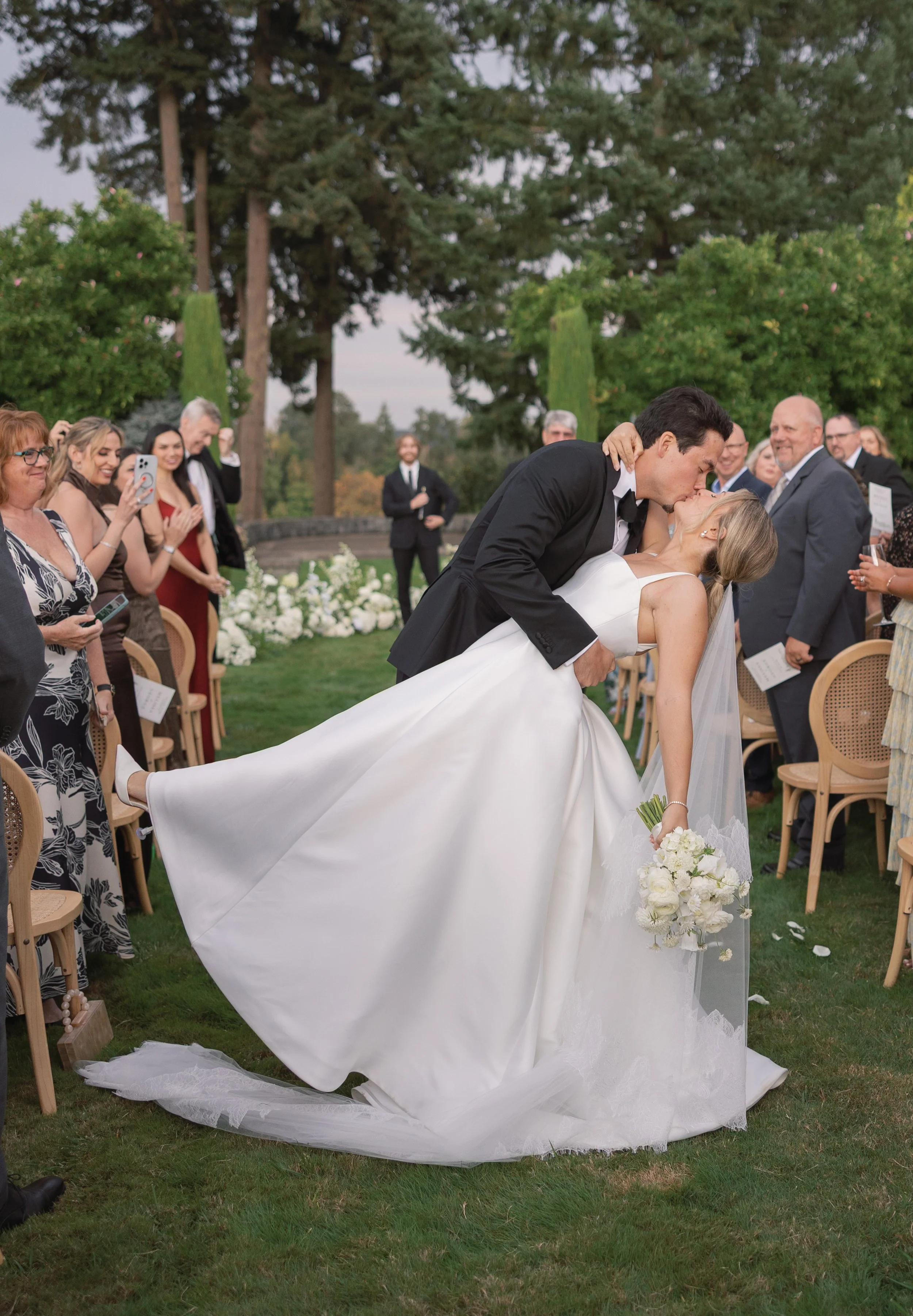 Groom dips bride on aisle and gives her a kiss Dundee Oregon