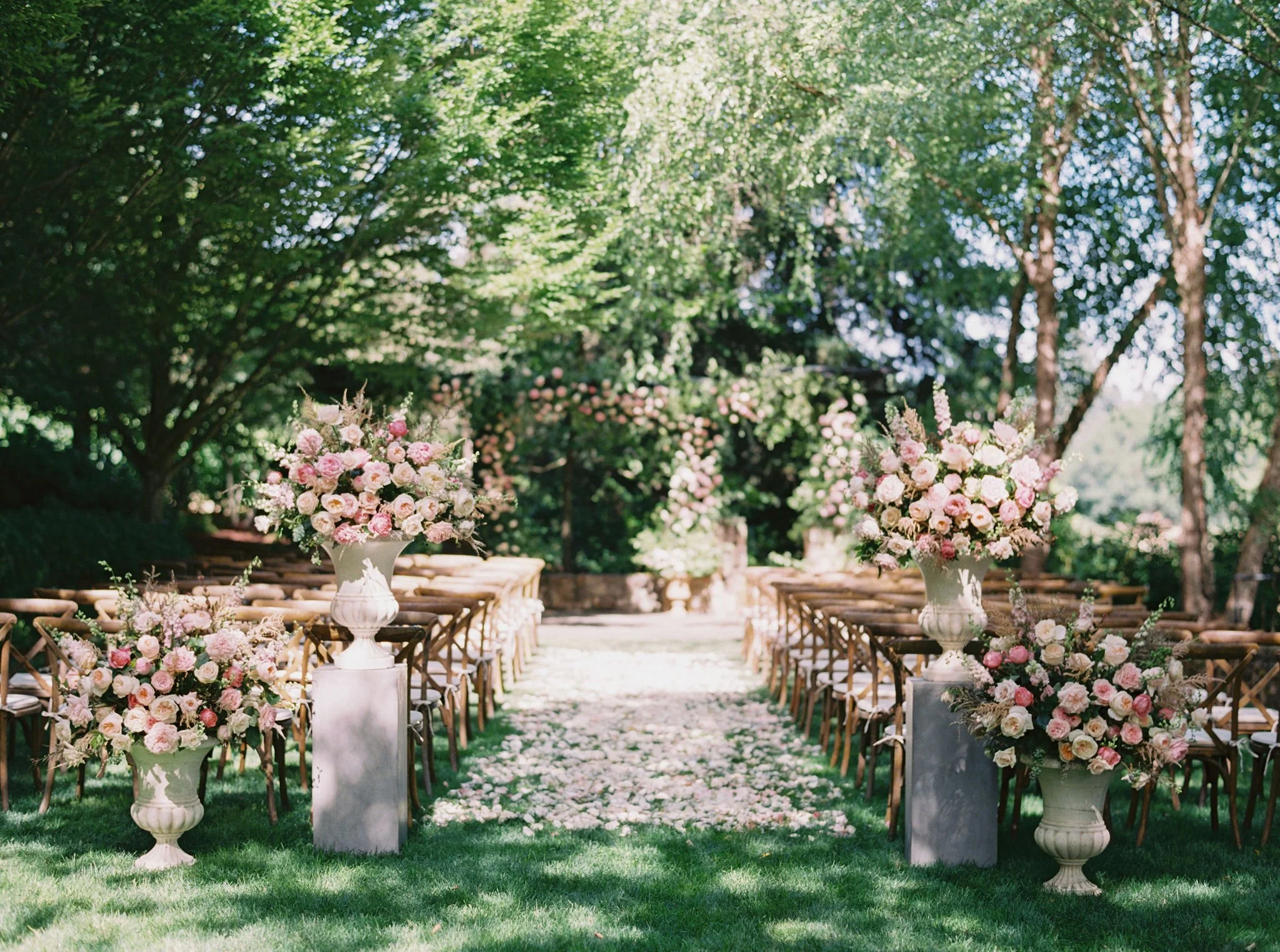 Luxury weekend wedding featuring lush ceremony florals in Oregon Wine Country