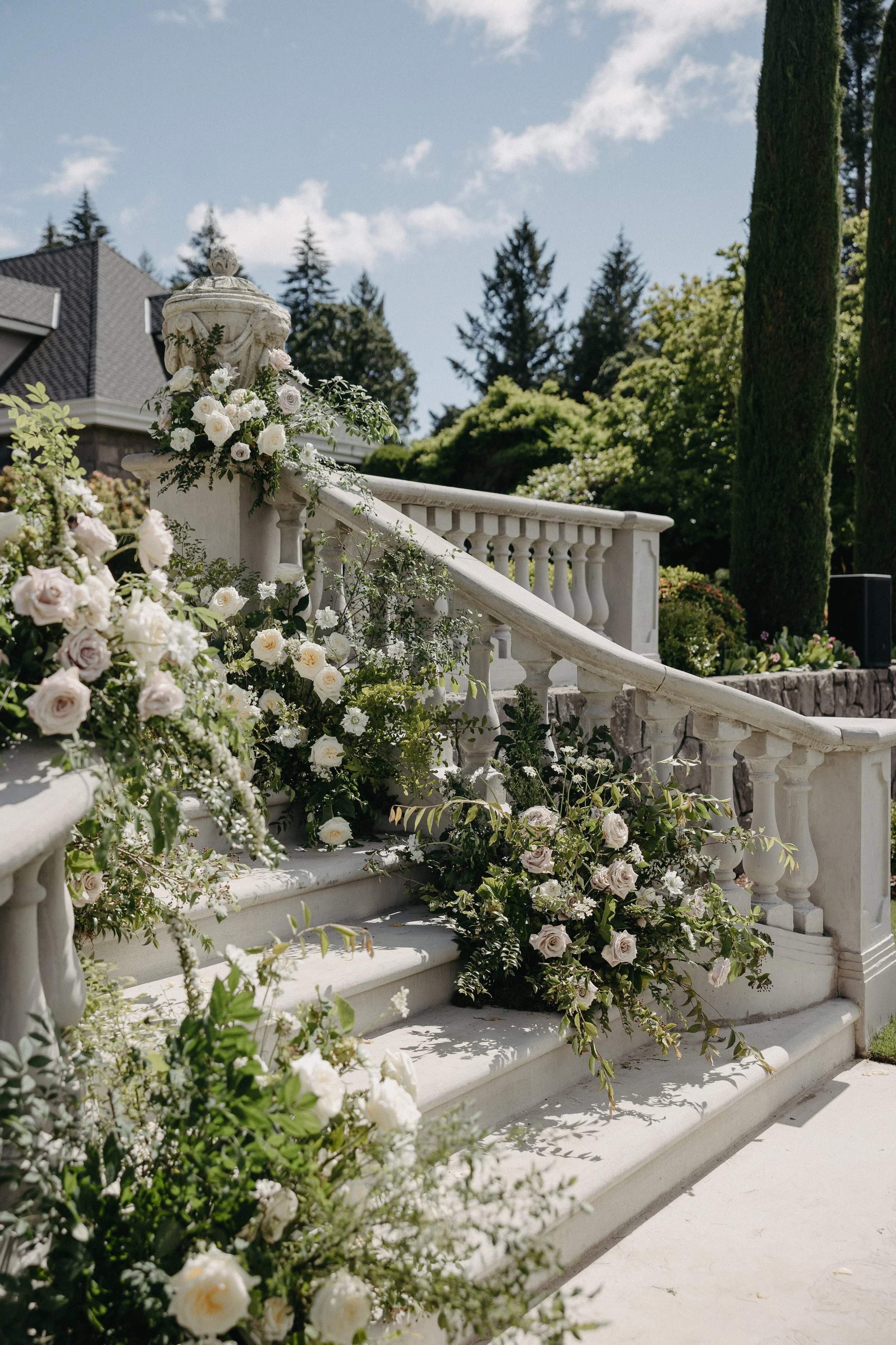 lush wedding florals on staircase pnw wedding