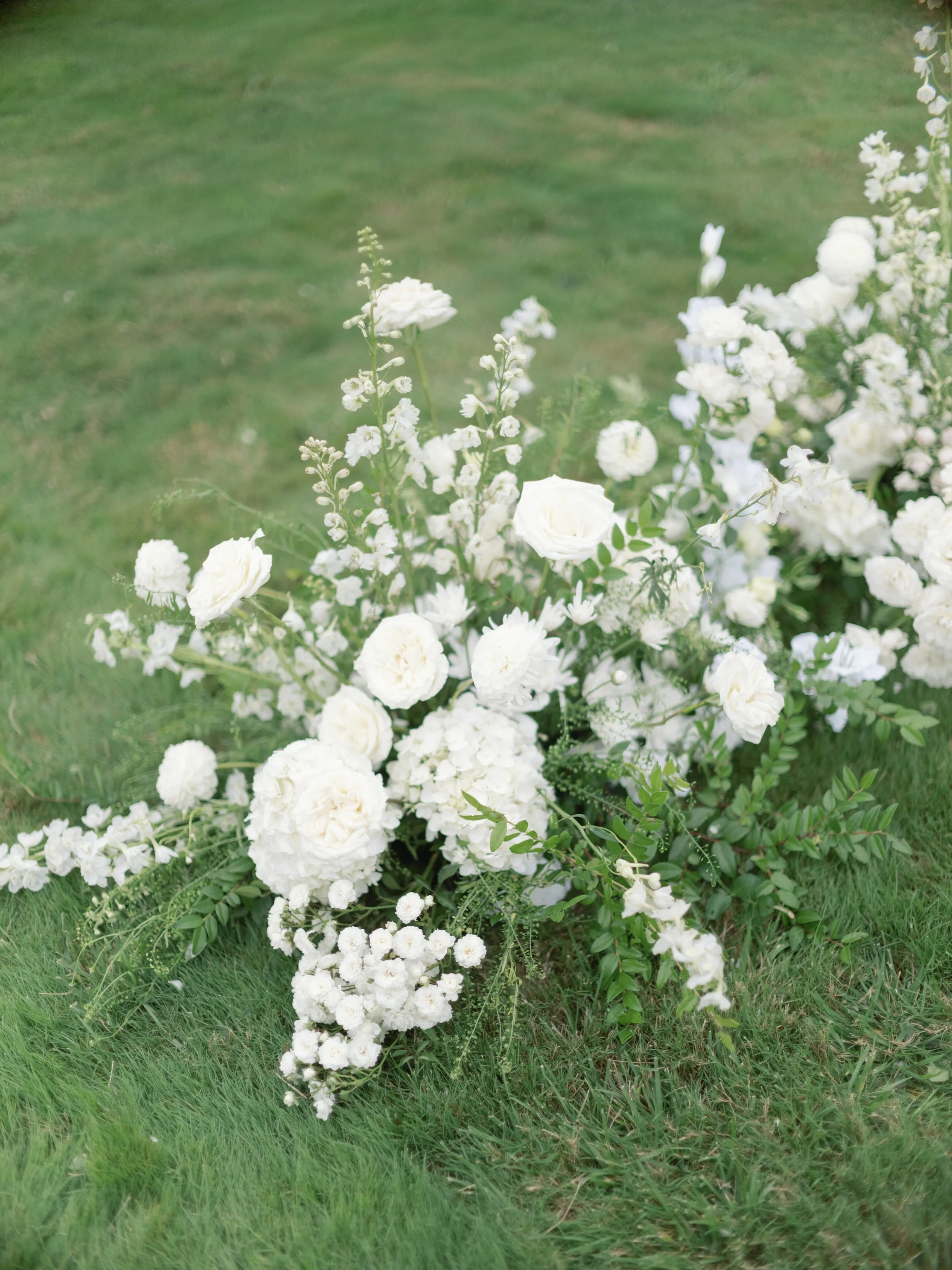Green and white wedding ceremony florals Del Mar Villa