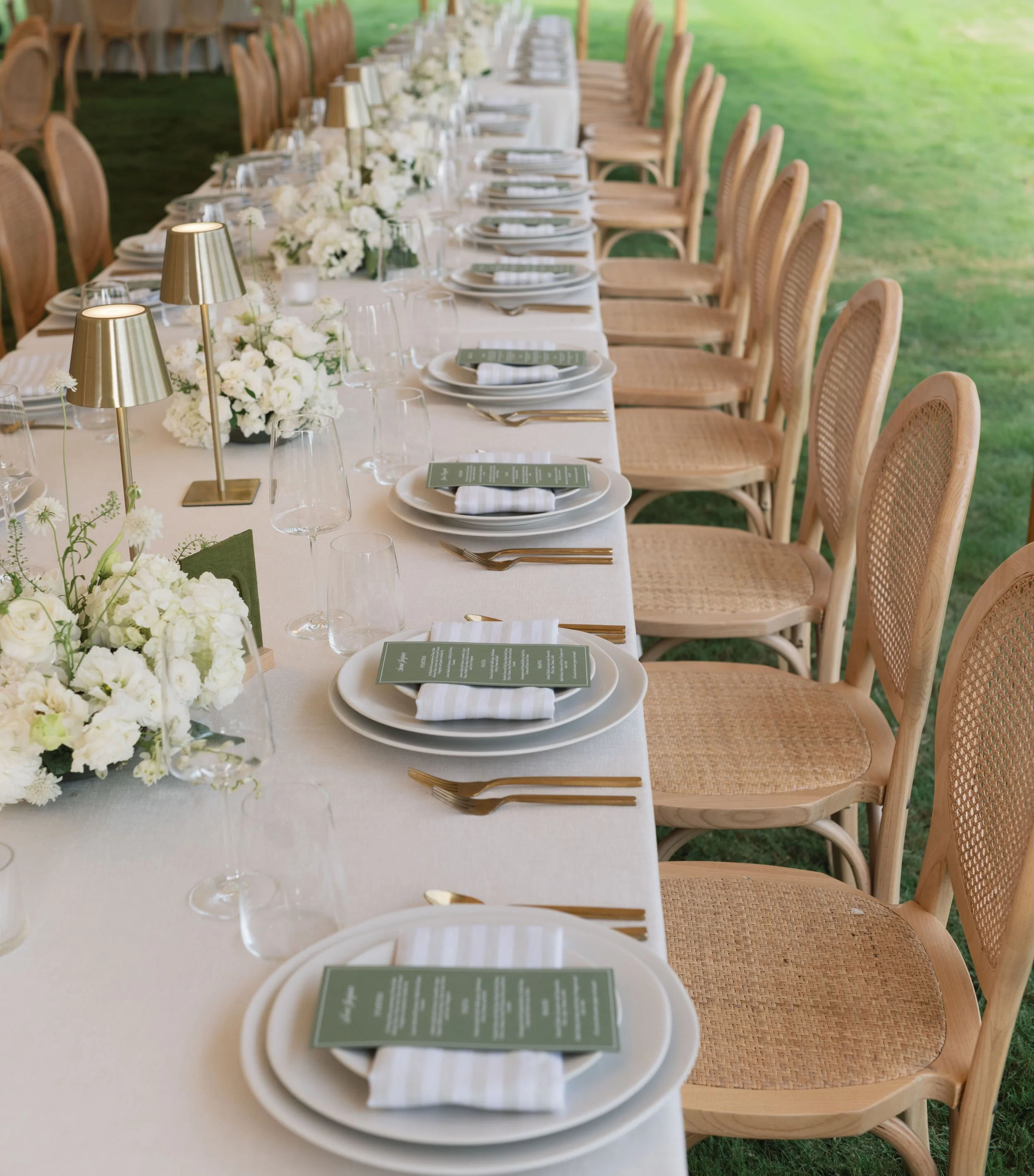 long shot of wedding reception table green and white
