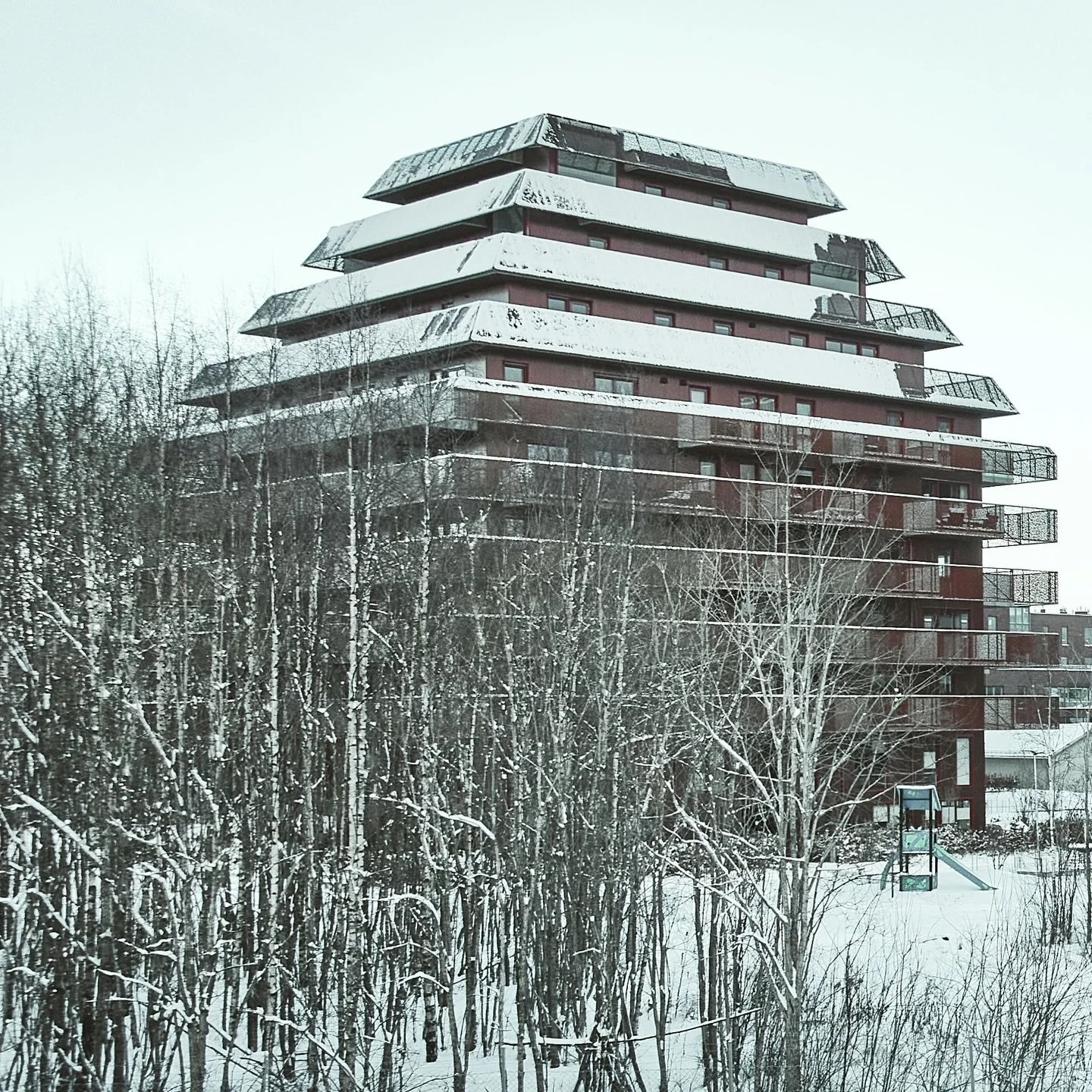 Have you been to Ski?

On the outskirts of the current city centre, a new residential area is under construction. The developer has engaged a handful of different architects to design medium-sized apartment blocks. They all have different architectur