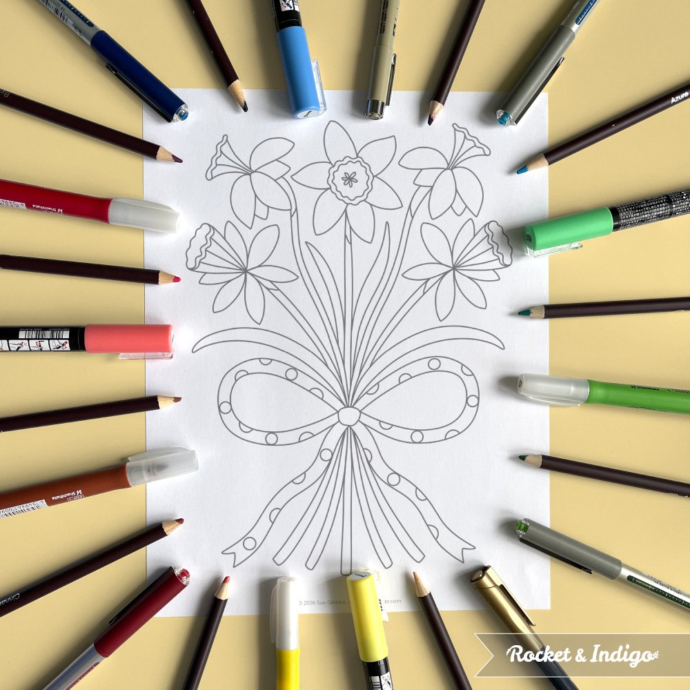 Colouring page with daffodils bouquet tied with a bow. The page is on a yellow background with pens and pencils at the edge.