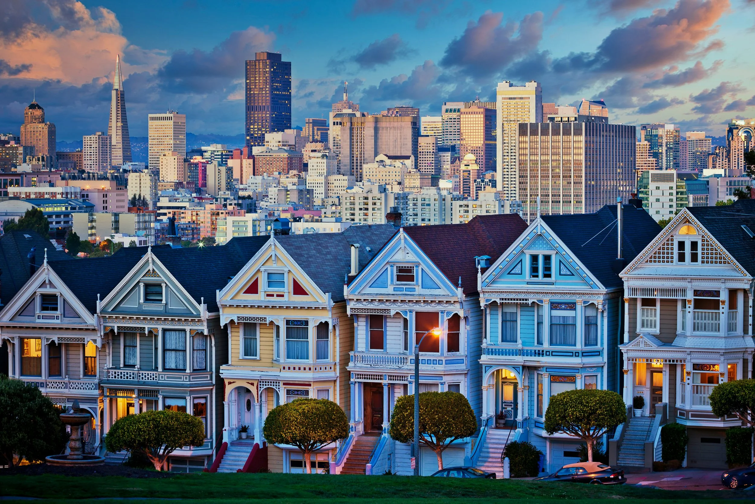 San Francisco Homes, with skyscrapers and sunset in background