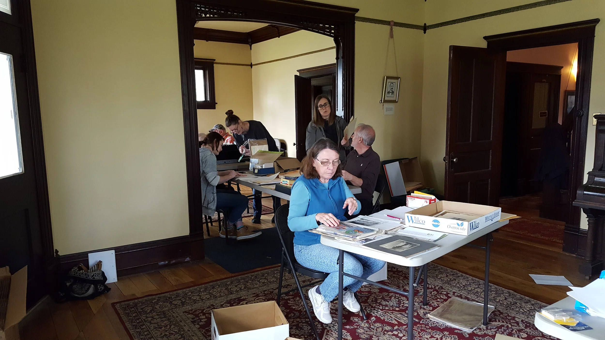 Volunteers archiving historic materials