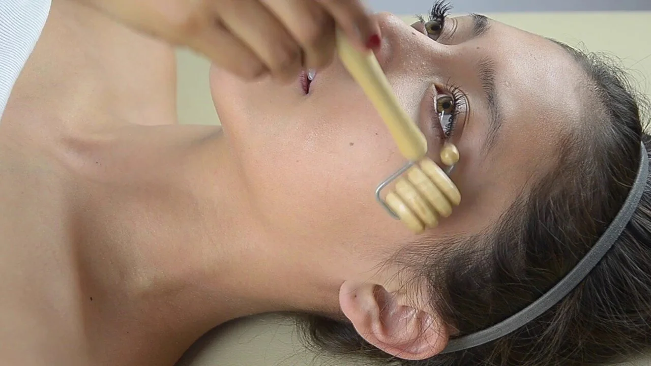 Madero facial therapy is the perfect choice for those who want to relieve stress and have healthy facial skin. It is a very relaxing massage with amazing results in the prevention of aging. In addition to relaxing our minds and facial muscles, it is also great for people who suffer from migraines, and for those who spend a lot of time working at a computer, making their eyes tired and tense. Using wooden tools we reach deep, achieving facial remodeling as well as activating fibroblasts that will produce more collagen and elastic fibers. Certain movements affect the muscle tissue, circulatory and lymphatic systems, thereby increasing the supply of nutrients and oxygen to the cells. With this non-invasive method, wrinkles are treated, the face becomes brighter and the skin is released from accumulated toxins.How many treatments do I need? Therapies can be done individually, where each individual massage will have its effect. However, if we still want to get a more concrete result, we are doing 6 - 10 massages in one series every other day. It is recommended that after the 50th year, repeat the series for the next month, followed by maintenance.Duration of therapy? The massage lasts for 20 minutes. And for even better effect, we also use essential oils for the prevention of aging (immortelle, carrot seeds, rosewood…)THE EFFECTS OF FACIAL MADEROTHERAPY:- Firming and giving tone (lifting effect)- Oval face reshaping- Promotes the production of elastin and collagen- Reduction of "bags" and swelling under the eyes- Oxygen and nutrient inflows increase- Refreshes the face and evens out the complexion- Prevention of facial aging- Improves circulation