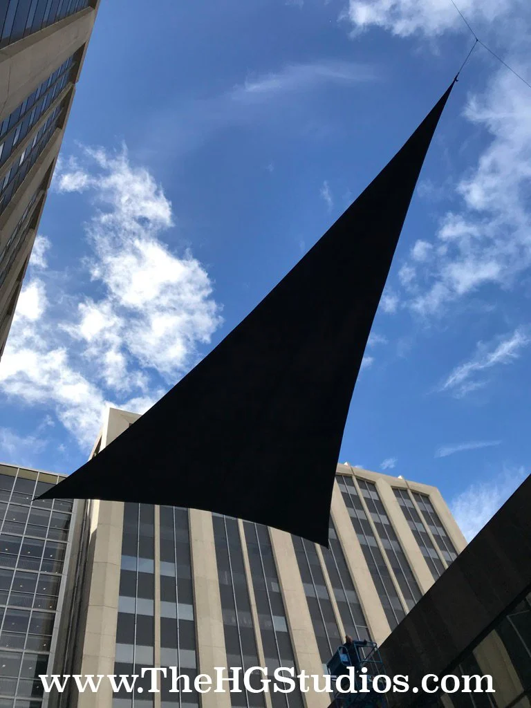 A large scale over head gold stretch fabric design by designer Hector Gutierrez and installation by The HG Studios at the California Market Center in Downtown Los Angeles.