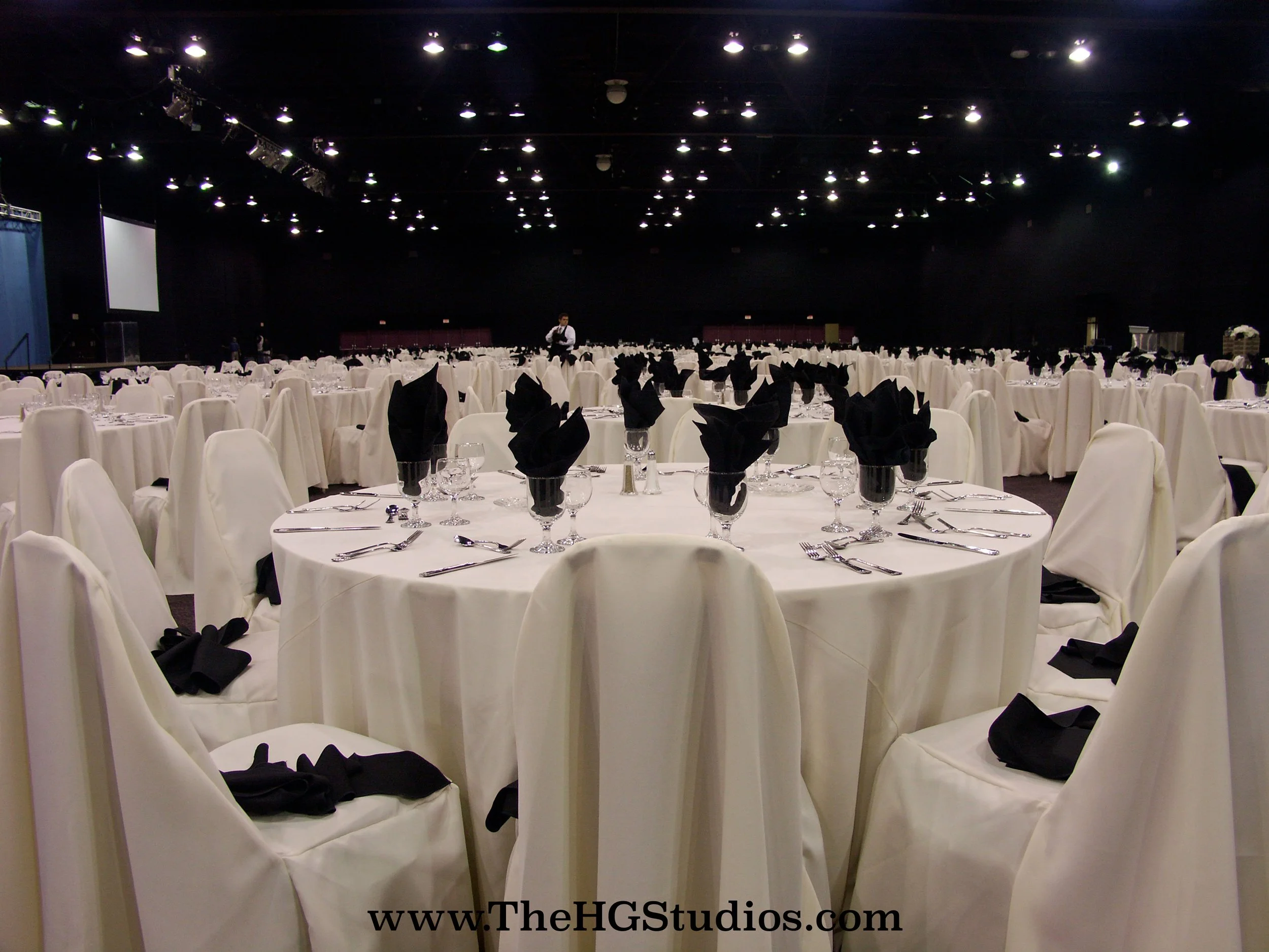 The HG Studios | Installation of 30ft High Custom Blackout Drape covering the perimeter walls of a convention center for a corporate event.