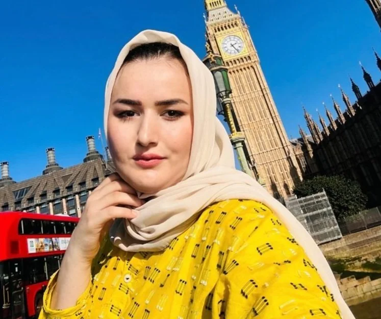 A picture of Mahrokh in front of Big Ben in London.