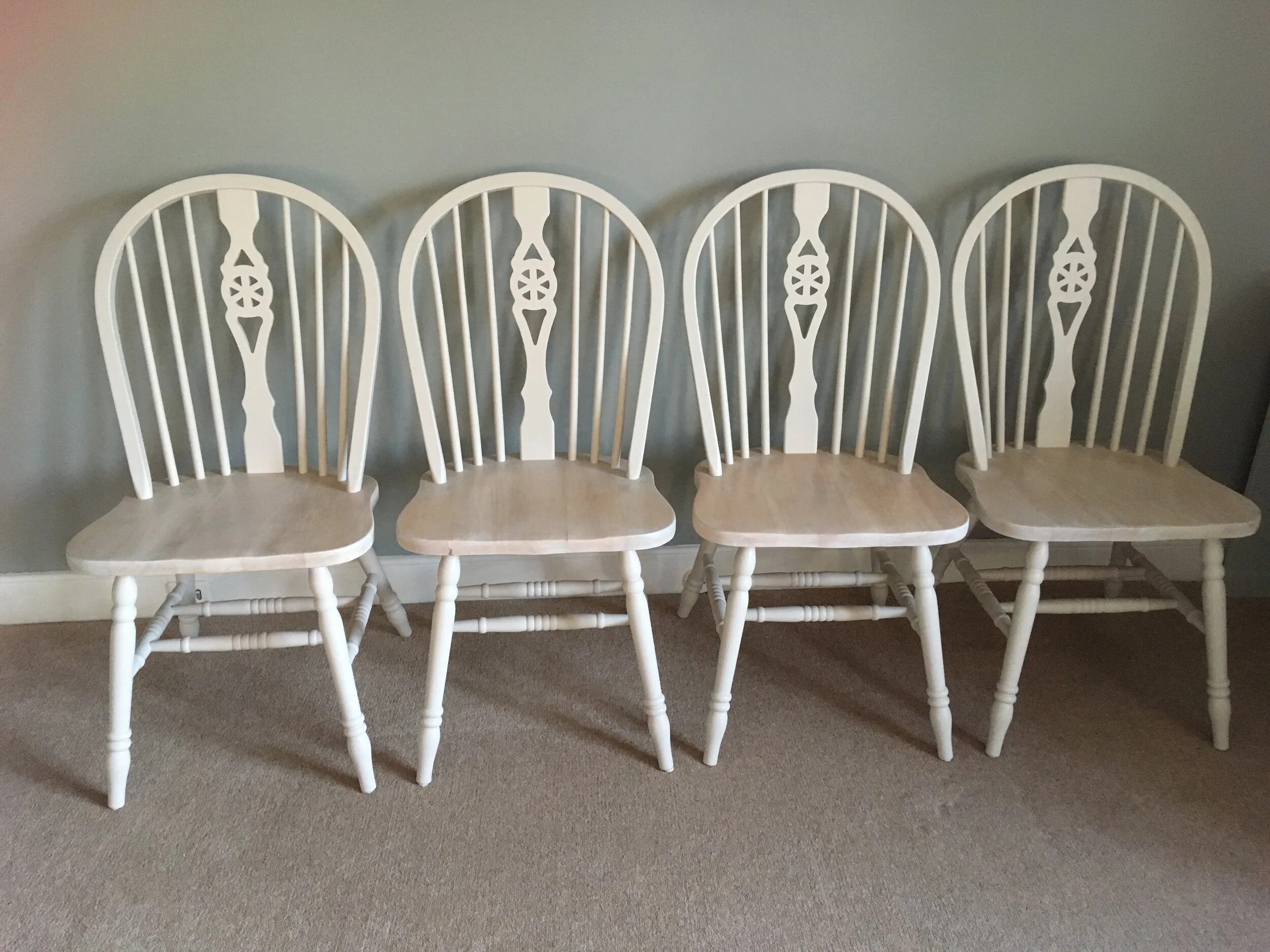 painted chairs with wooden seats
